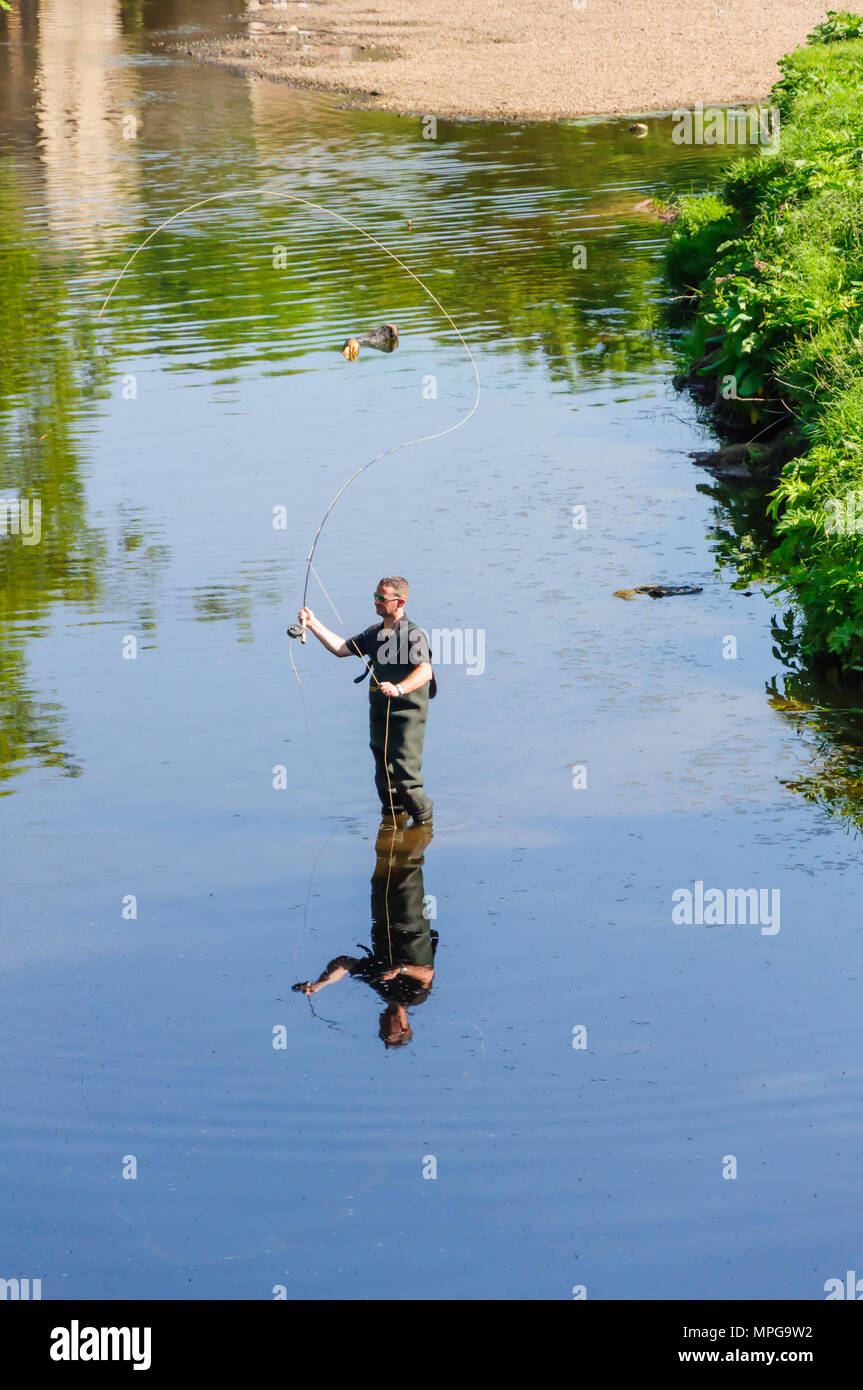 Glasgow, Scotland, UK. 23rd May, 2018. UK Weather A man wearing waders