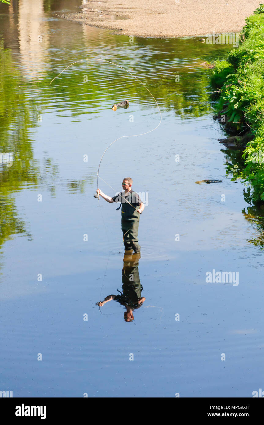 Glasgow, Scotland, UK. 23rd May, 2018. UK Weather A man wearing waders