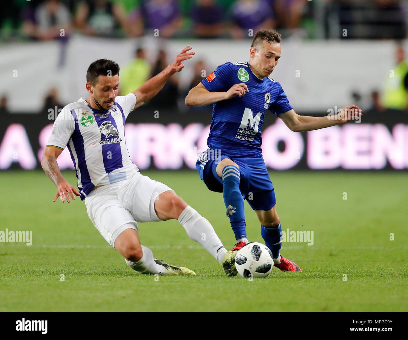 BUDAPEST, HUNGARY - JUNE 27: (l-r) Tokmac Chol Nguen of Ferencvarosi TC  fights for the ball with Dániel Farkas of Mezokovesd Zsory FC during the  Hungarian OTP Bank Liga match between Ferencvarosi TC and Mezokovesd Zsory  FC at Groupama