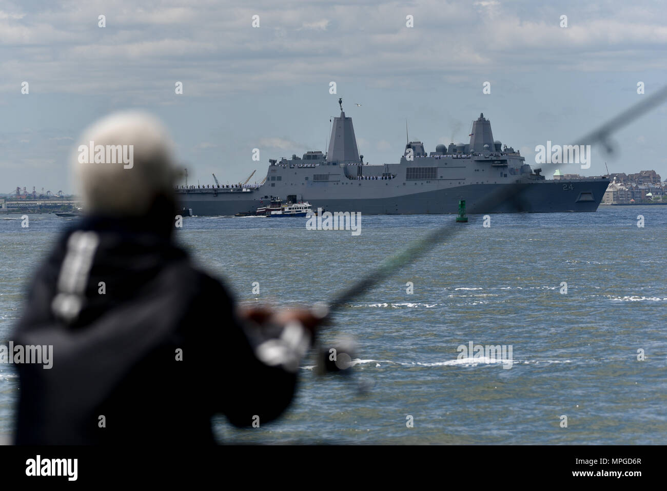 New York, USA. 23rd May, 2018. The Norfolk-based USS Arlington joins the Parade of Ships as it makes its way past the Statue of Liberty on the opening day of Fleet Week on May 23, 2018 in New York City. Credit: Erik Pendzich/Alamy Live News Stock Photo