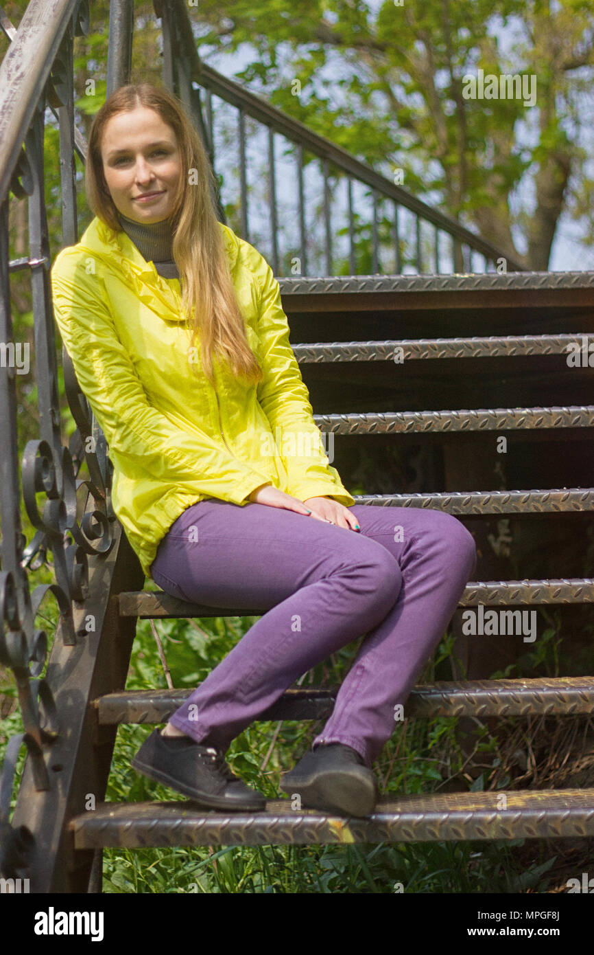 teenage girl sitting alone on the stairs Stock Photo - Alamy