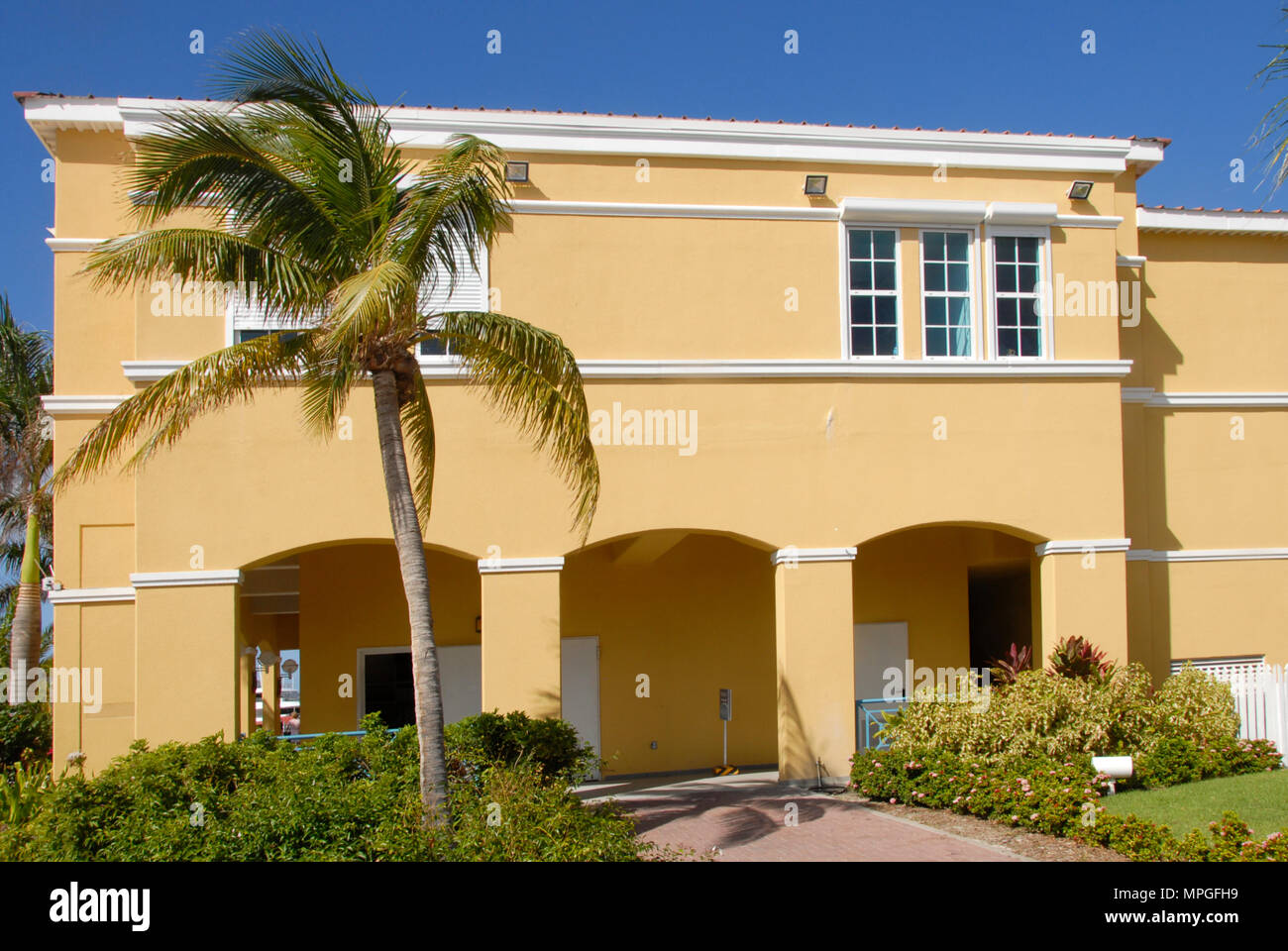 Smart yellowpainted house, St Maarten, Caribbean Stock Photo Alamy