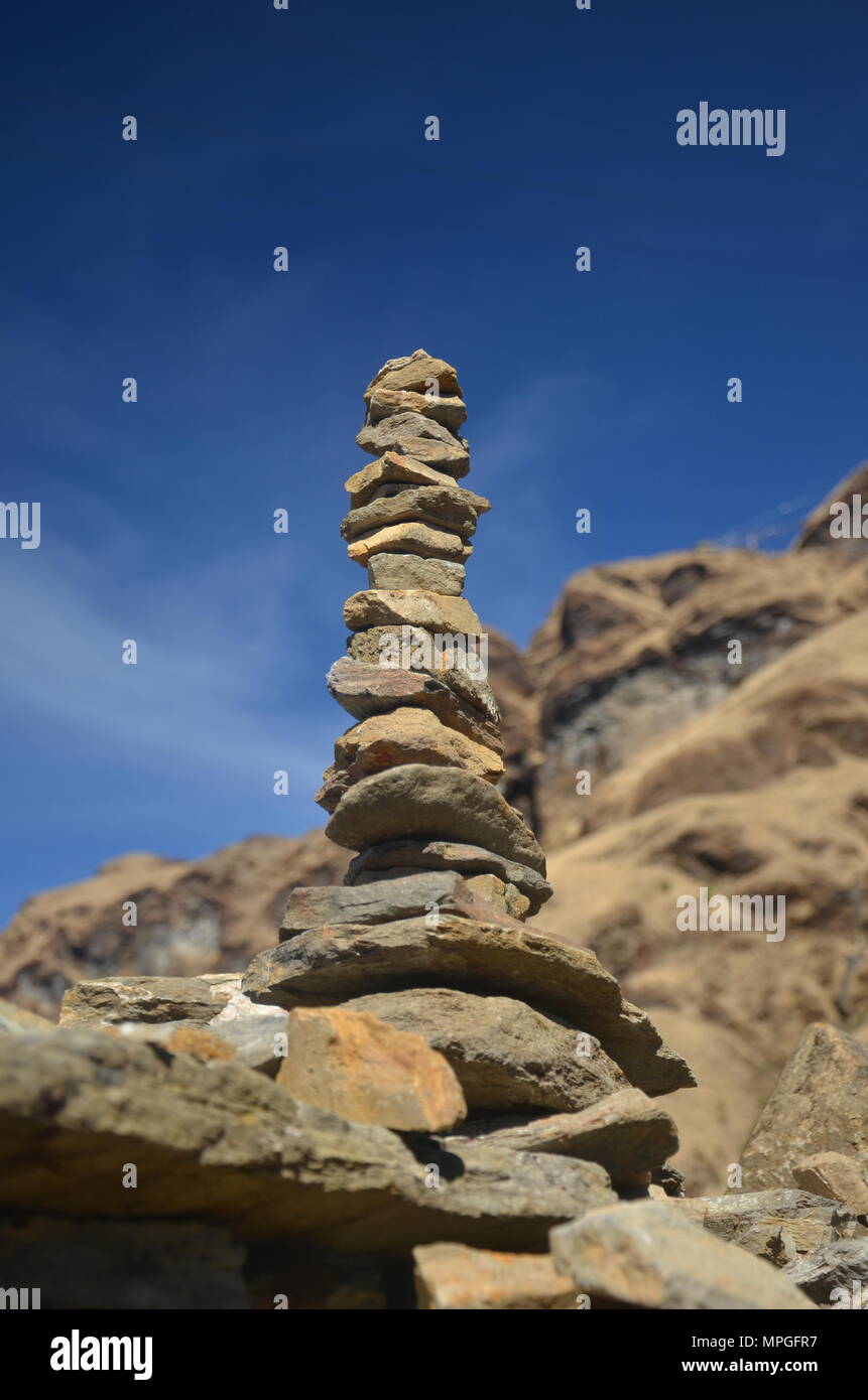 Stone stacking in upper Himalayas, a Buddhist practice. It is believed that stacking of stone will bring good fortune to the person who stacks. Stock Photo