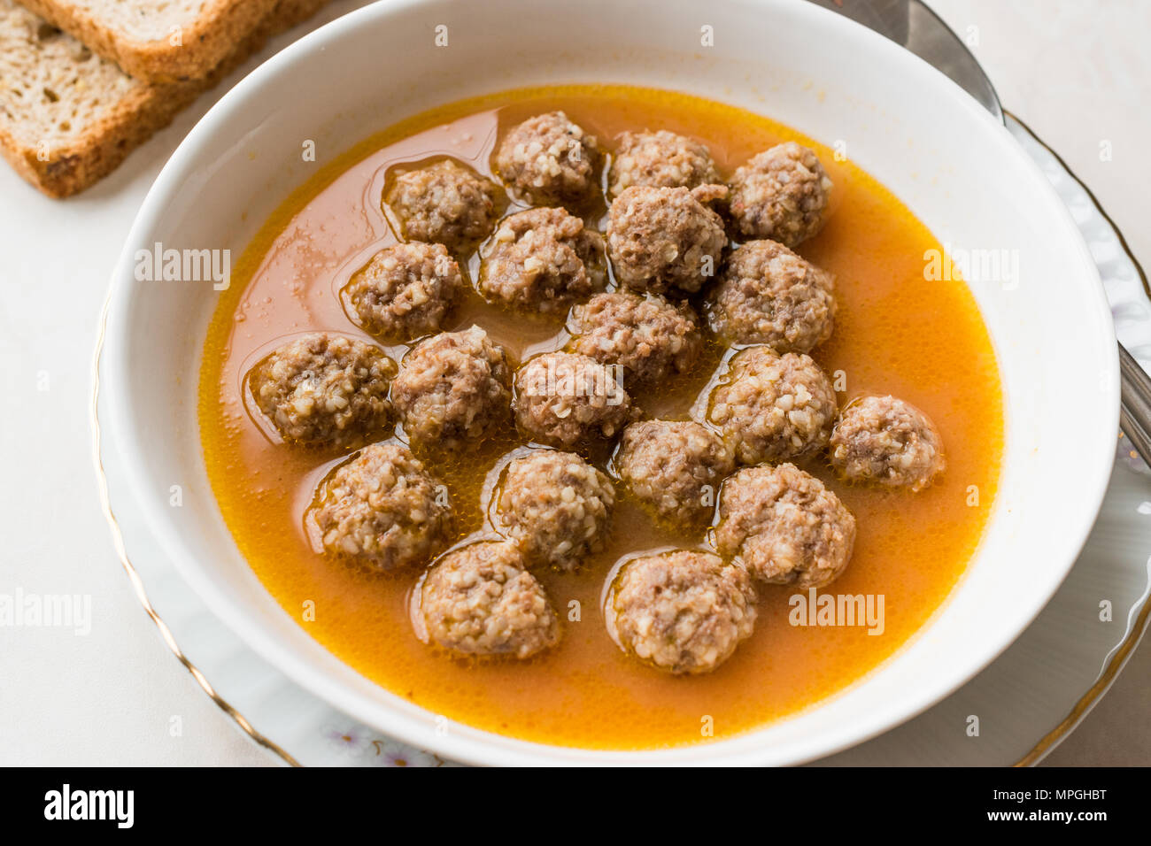 Turkish food Sulu Kofte / Juicy Meatballs Soup with Bread. Traditional
