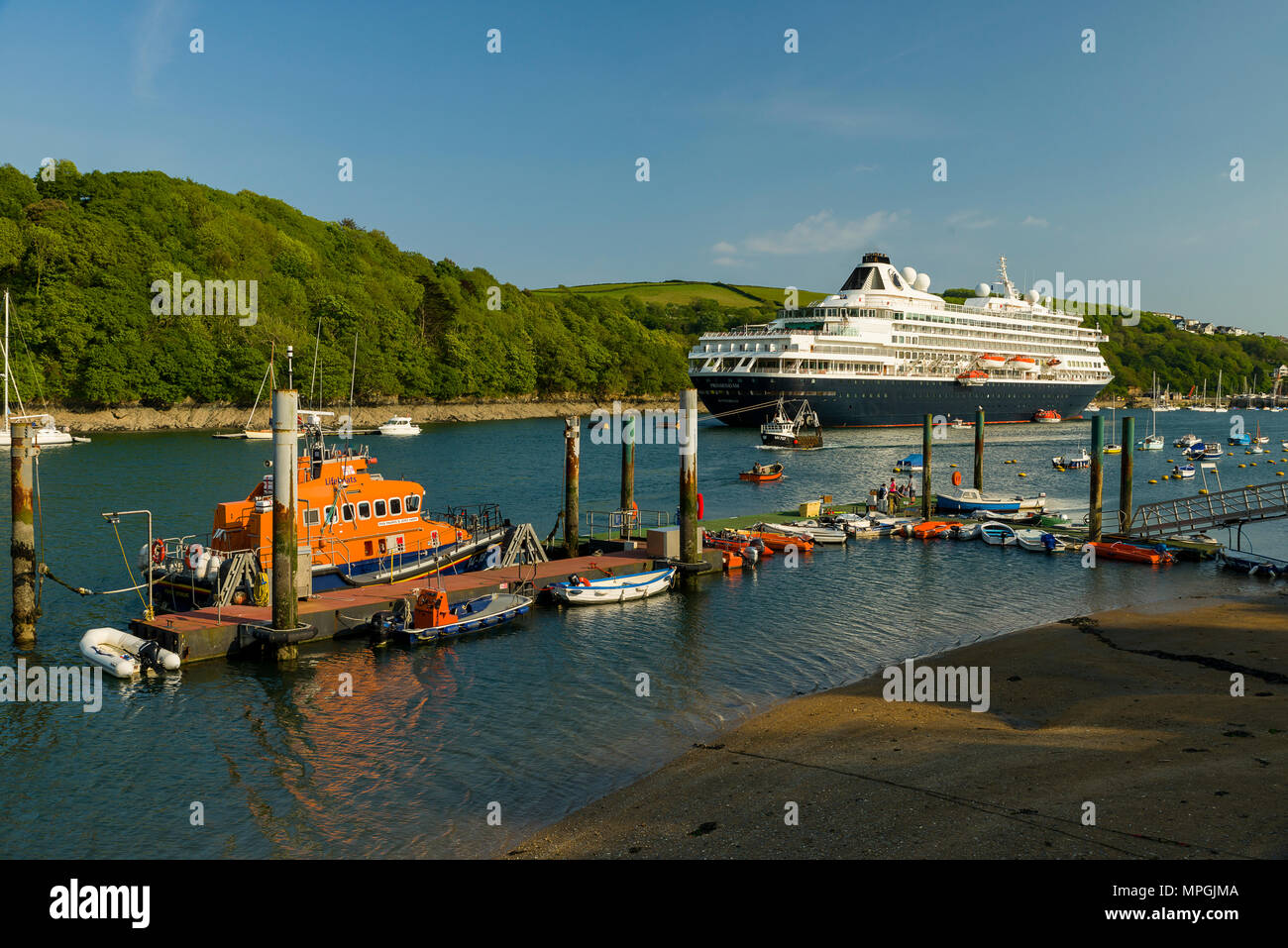 The Prinsendam, a Dutch cruise line company anchors in Fowey, Cornwall for a day trip before heading off to the Scilly Isles as it journeys around the Stock Photo