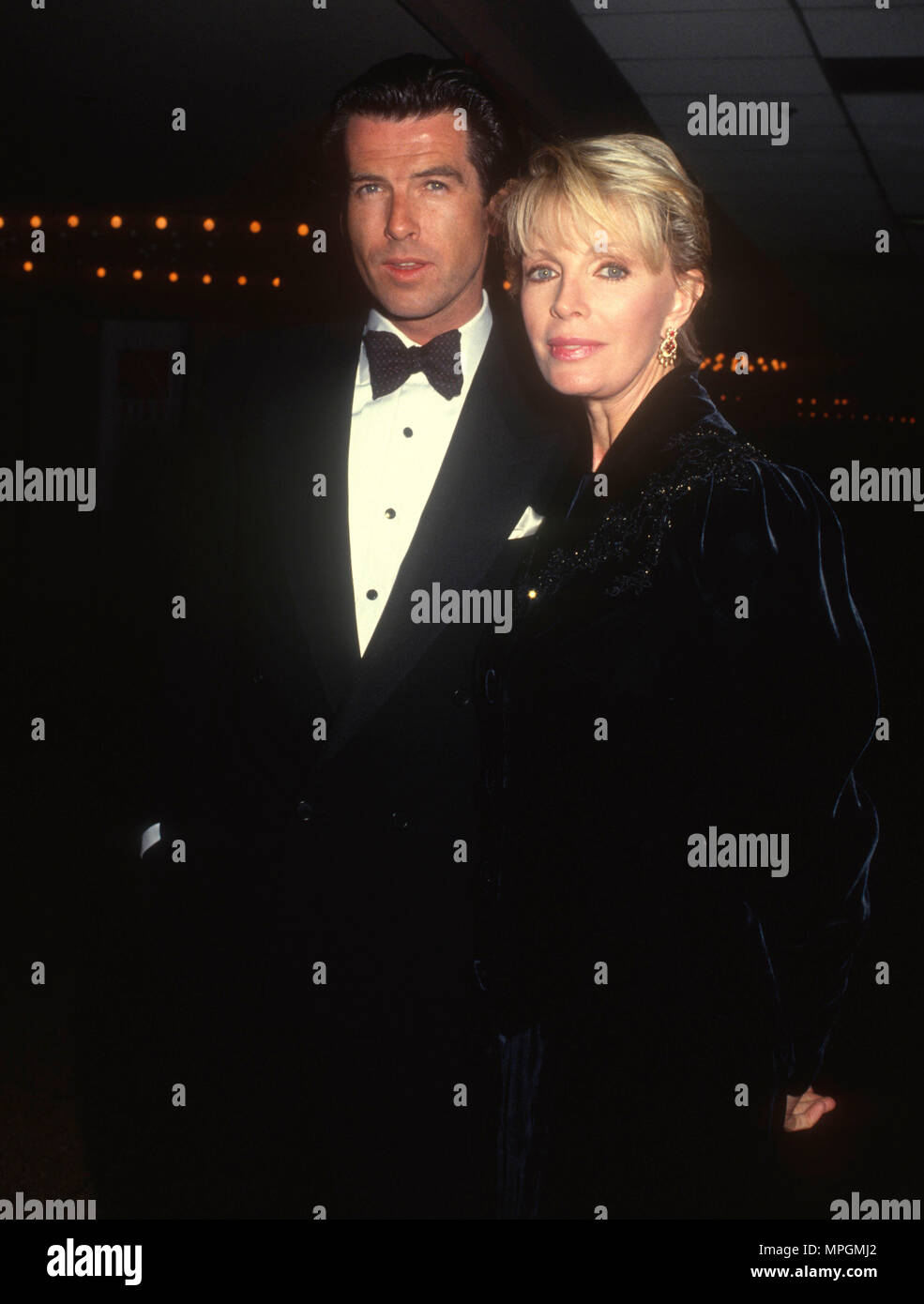 LOS ANGELES, CA FEBRUARY 13 (LR) Actor Pierce Brosnan and wife