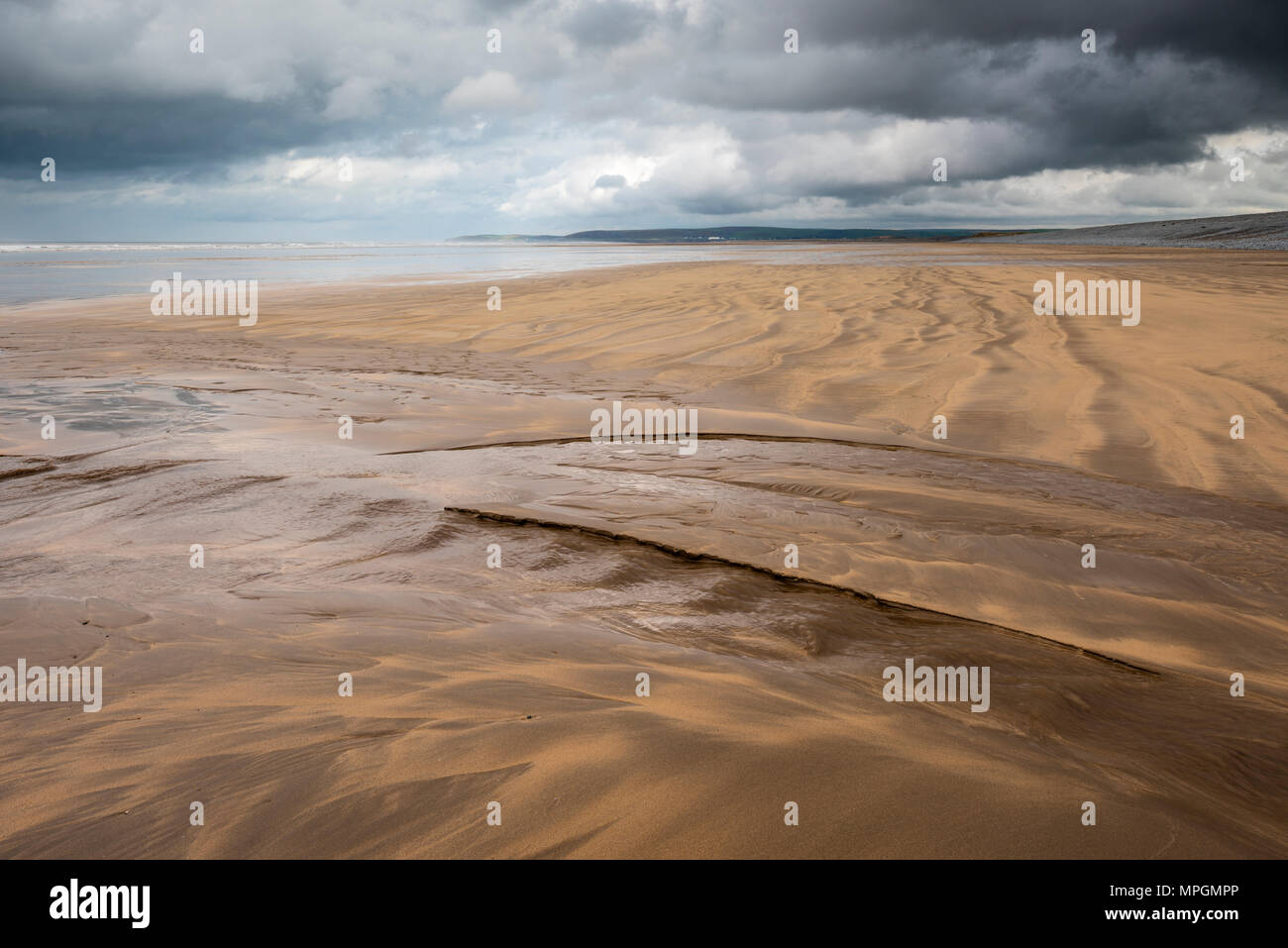 Patterns left in a sandy beach by the retreating tide at Westward Ho!, North Devon, England. Stock Photo