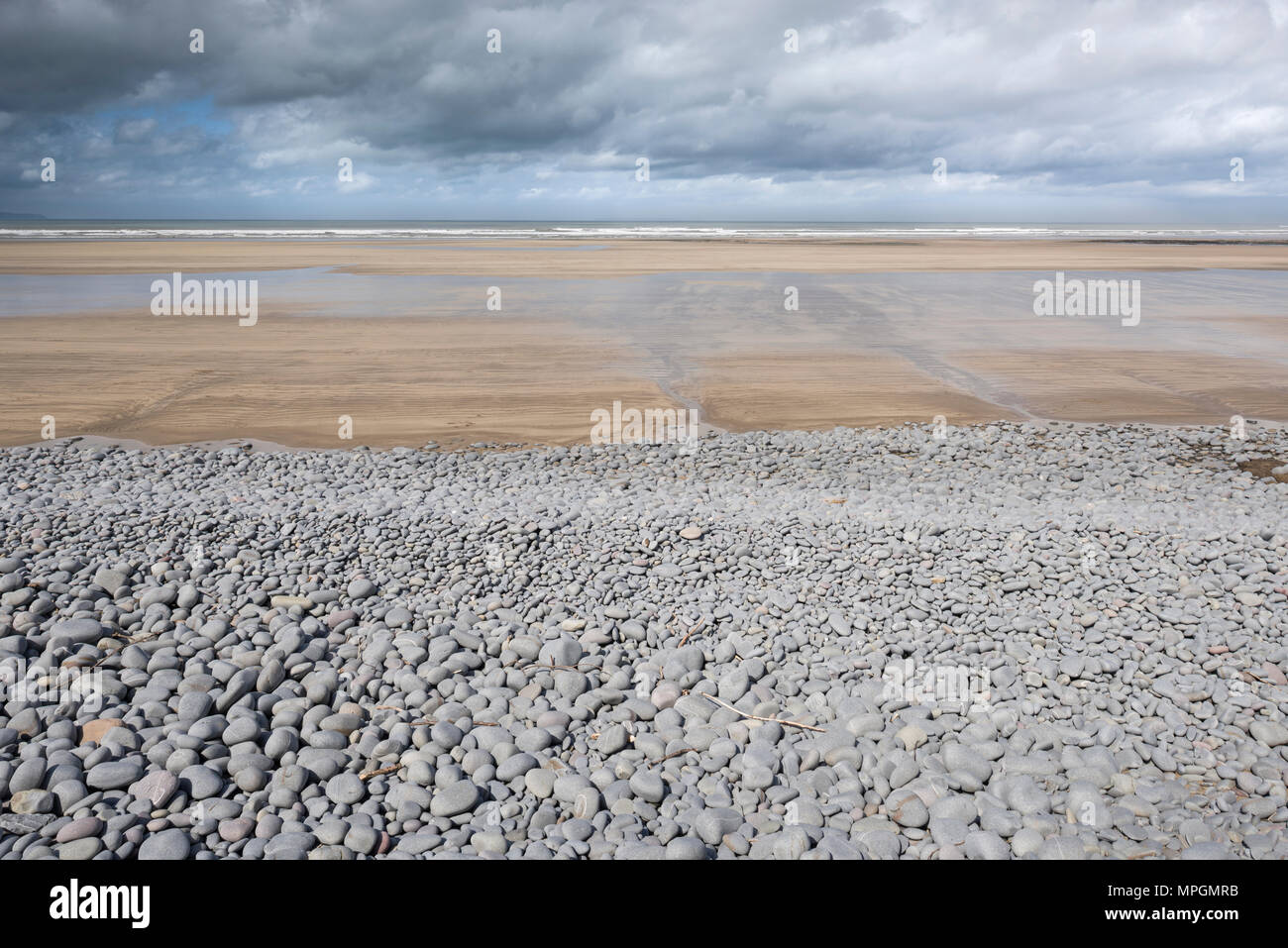 The sandy beach and pebble ridge Westward Ho! on the North Devon coast, England. Stock Photo