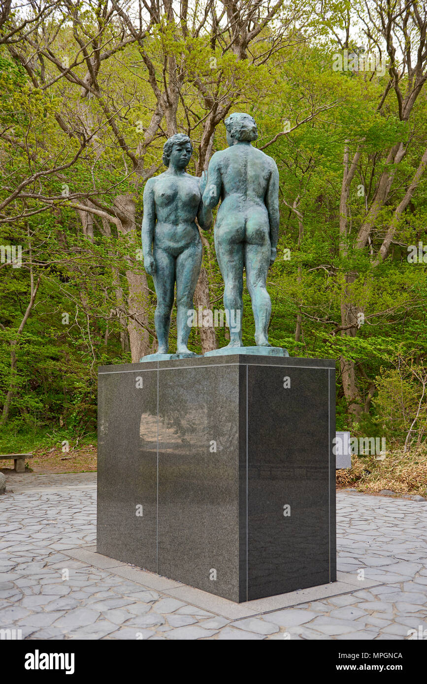 Statue of Two Maidens (also known as statue of Otome) by Kotaro Takamura in Towada Lake, Aomori Prefecture, Japan. The bronze statue depicts two nude Stock Photo