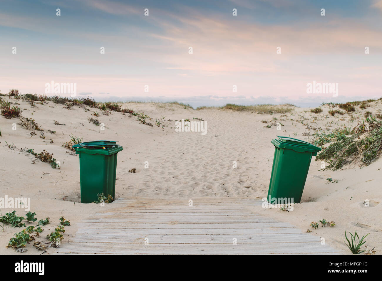 Two green trash can on the beach Stock Photo