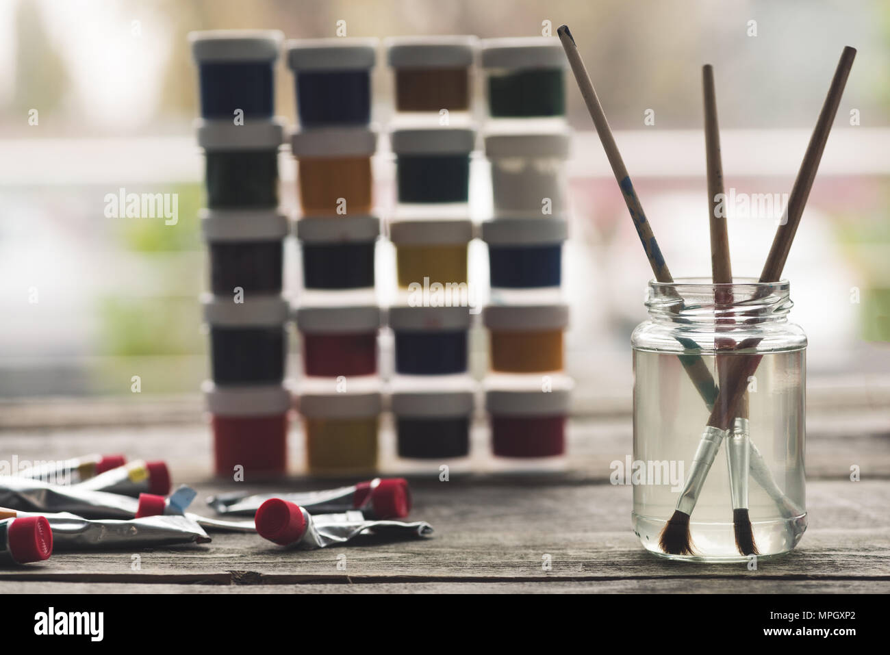 Paint brushes in liquid Stock Photo Alamy