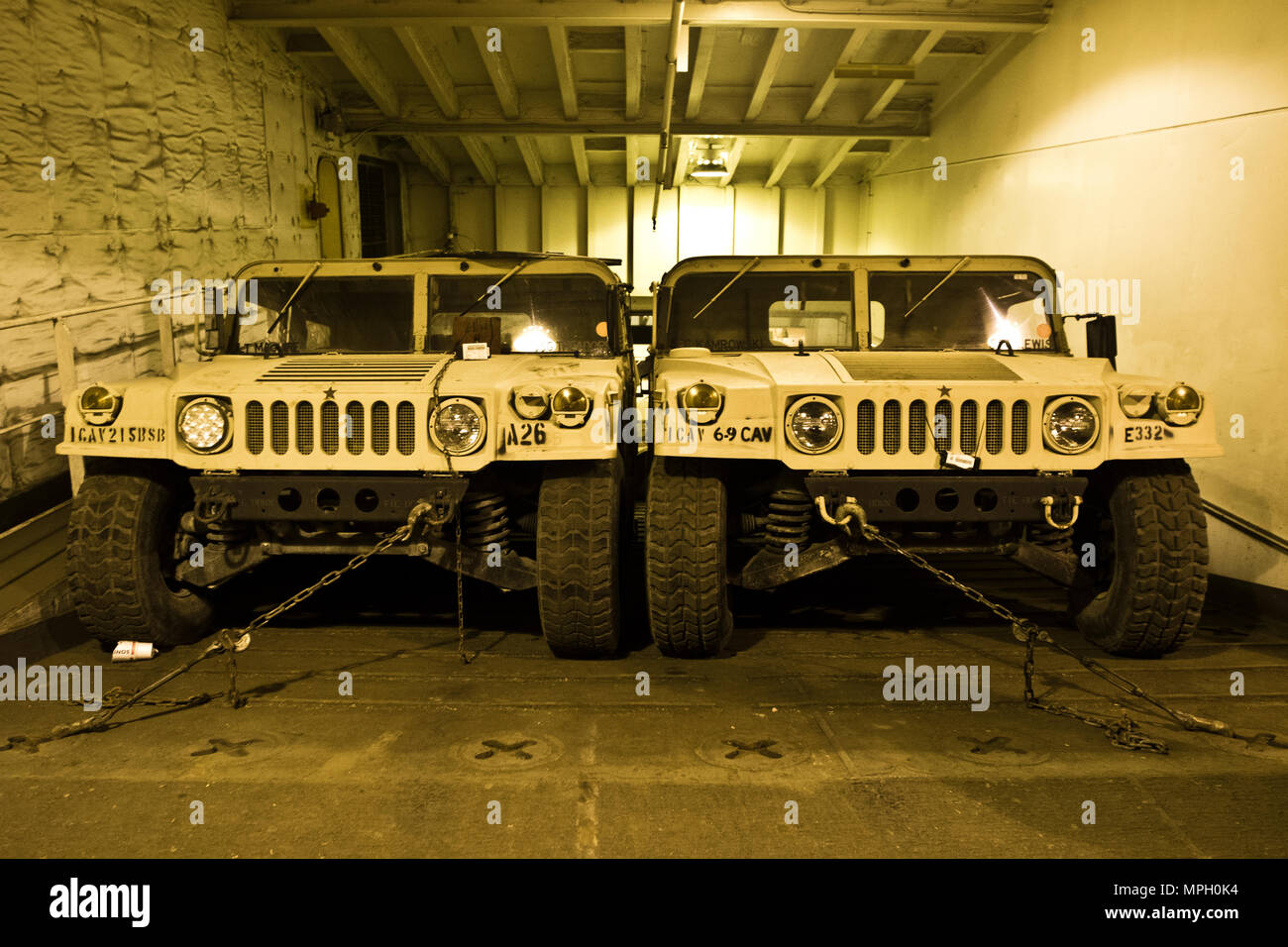 Humvees are staged on the USNS Mendonca at Shuaiba Port, Kuwait, on Feb. 28, 2017. The Mendonca is used to import and export U.S. Military vehicles in support of operations in the USCENTCOM AOR. (U.S. Army Photo by Staff Sgt. Dalton Smith) Stock Photo