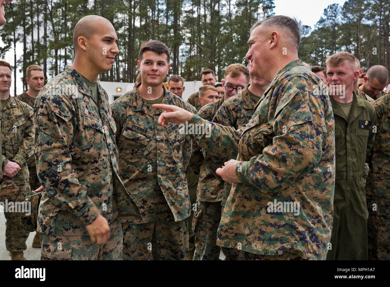 U.S. Marine Corps Gen. Glenn M. Walters, right, 34th assistant commandant of the Marine Corps, speaks with Lance Cpl. Drake Monzon, data technician, Marine Unmanned Aerial Vehicle Squadron 2 (VMU-2), Jacksonville, Cherry Point, N.C., Feb. 24, 2017. Walters spoke to the Marines about present and future missions, initiatives, and plans for the Marine Corps. (U.S. Marine Corps photo by Lance Cpl. Hailey D. Clay) Stock Photo