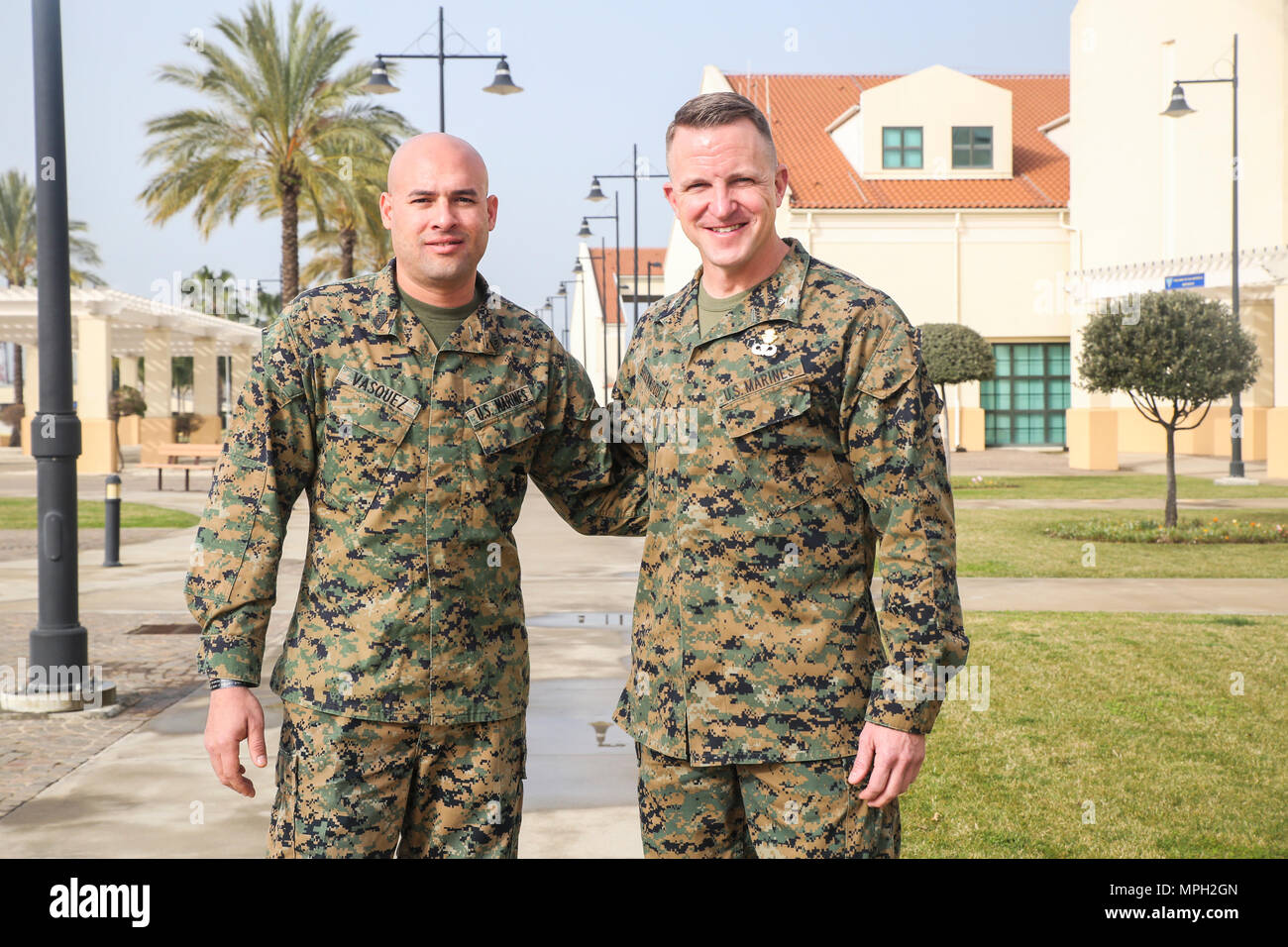 Gunnery Sgt. Juan Vasquez Jr., left, a U.S. Marine assigned to Special Purpose Marine Air-Ground Task Force – Crisis Response – Africa, poses for a photo with Col. Daniel Greenwood, the commanding officer of SPMAGTF-CR-AF, at Naval Air Station Sigonella, Italy, Feb. 25, 2017. Greenwood formerly served as the commanding officer for Marine Corps Recruiting Station Fort Lauderdale, Florida, while Vasquez was a poolee for the station in 2003. (U.S. Marine Corps photo by Cpl. Samuel Guerra) Stock Photo