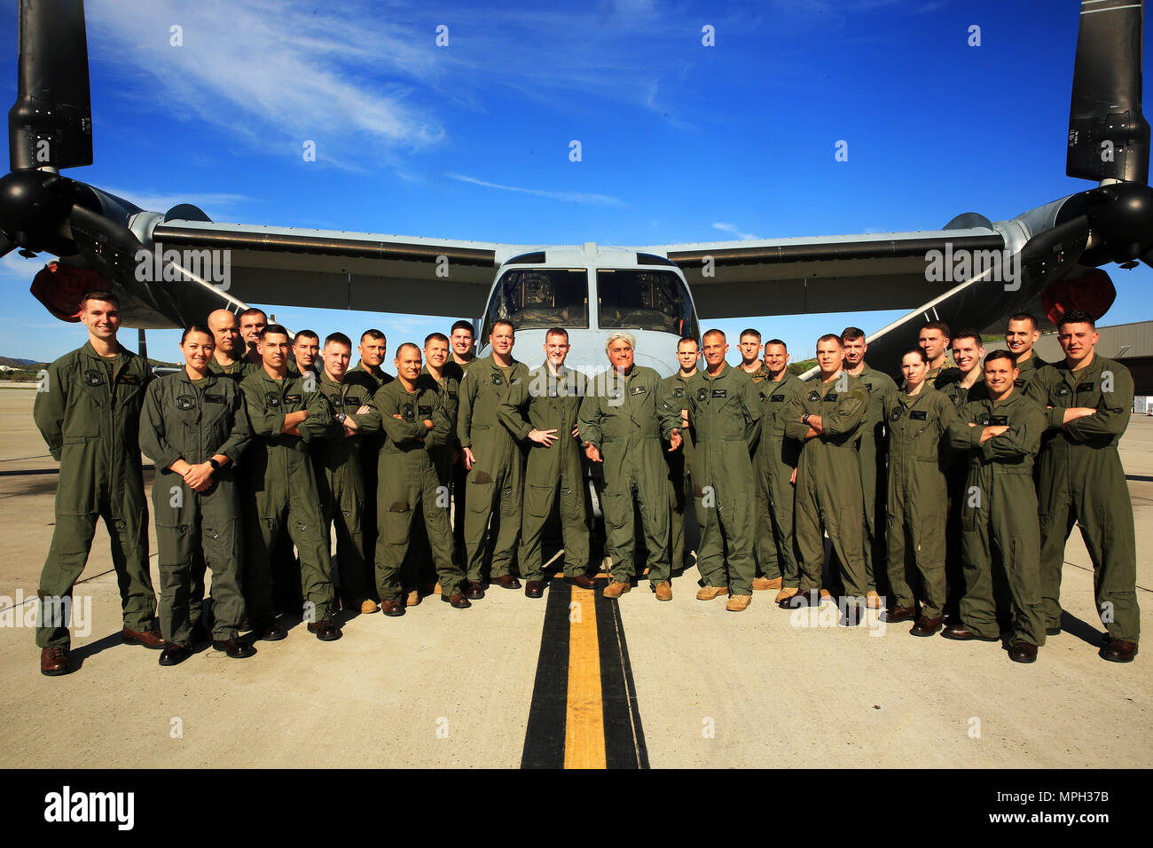 CAMP PENDLETON, Calif. - Jay Leno poses with members of Marine Medium Tiltrotor Squadron  (VMM) 164 at Marine Corps Air Station Camp Pendleton, Calif., Mar. 2. Leno flew with VMM-164 to film a segment for his show 'Jay Leno's Garage' and later met members of the squadron. (U.S. Marine Corps Photo by Lance Cpl. Dylan Overbay/Released) Stock Photo