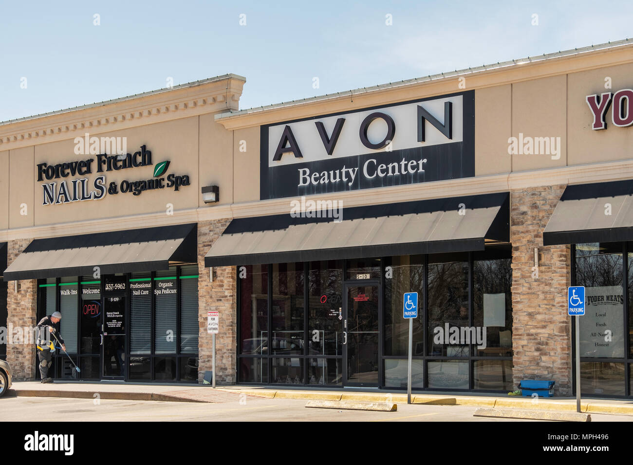 A strip mall containing Avon Beauty Center and Forever French Nails, a nail  salon in Wichita, Kansas, USA Stock Photo - Alamy