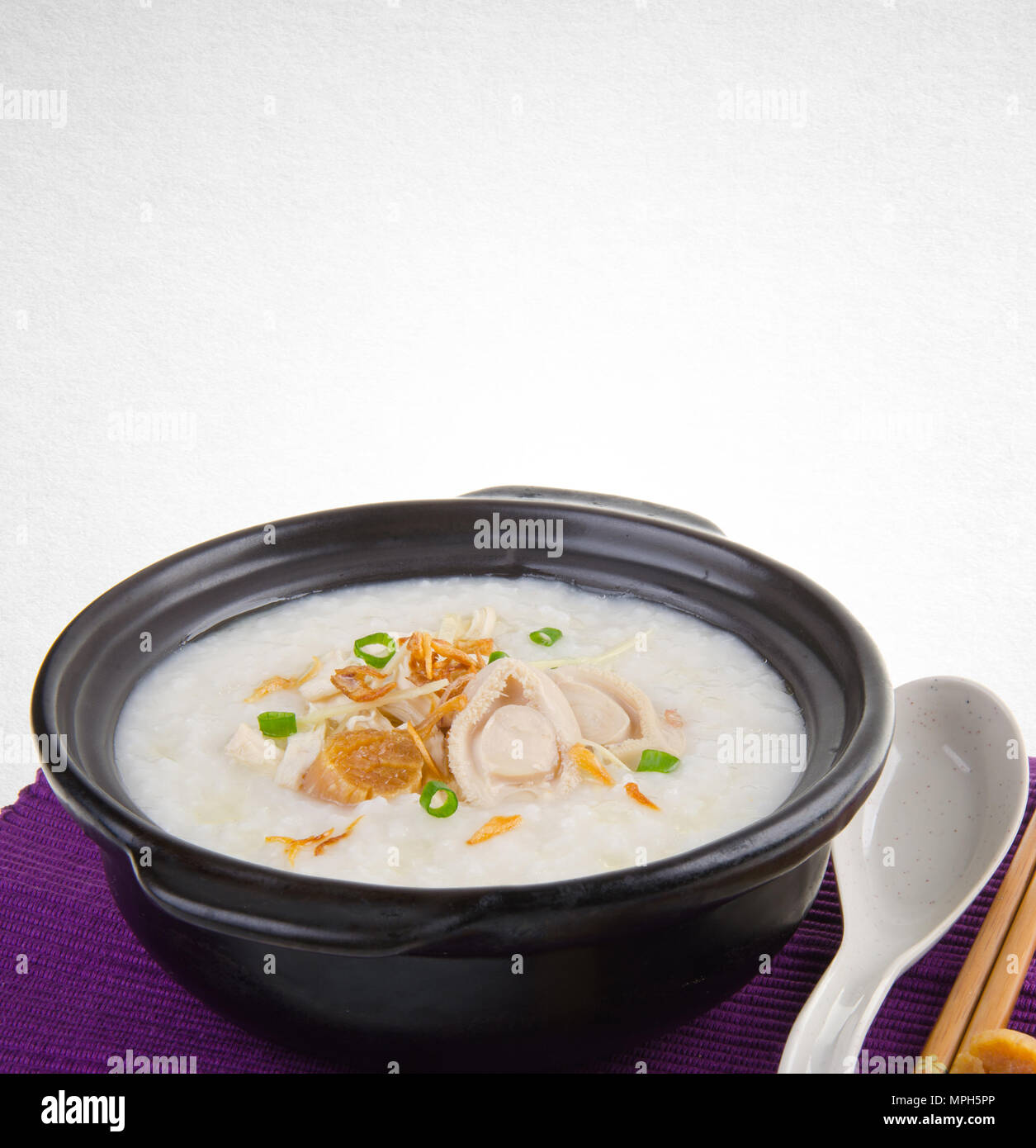 Porridge or abalone porridge in claypot on a background Stock Photo Alamy
