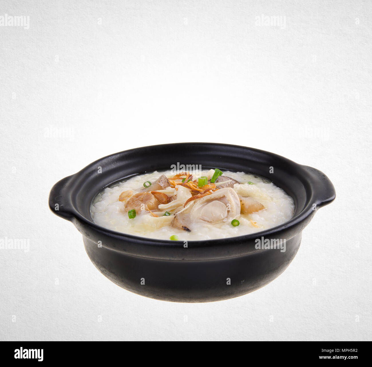 Porridge or abalone porridge in claypot on a background Stock Photo Alamy