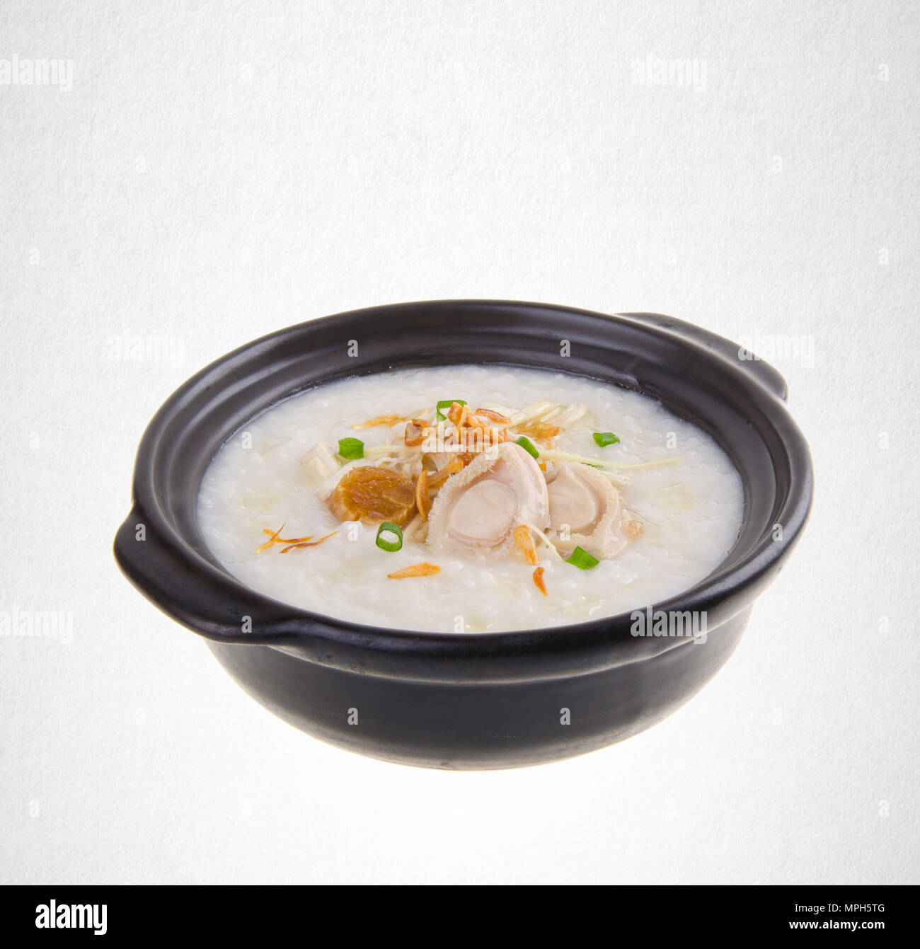 Porridge or abalone porridge in claypot on a background Stock Photo Alamy