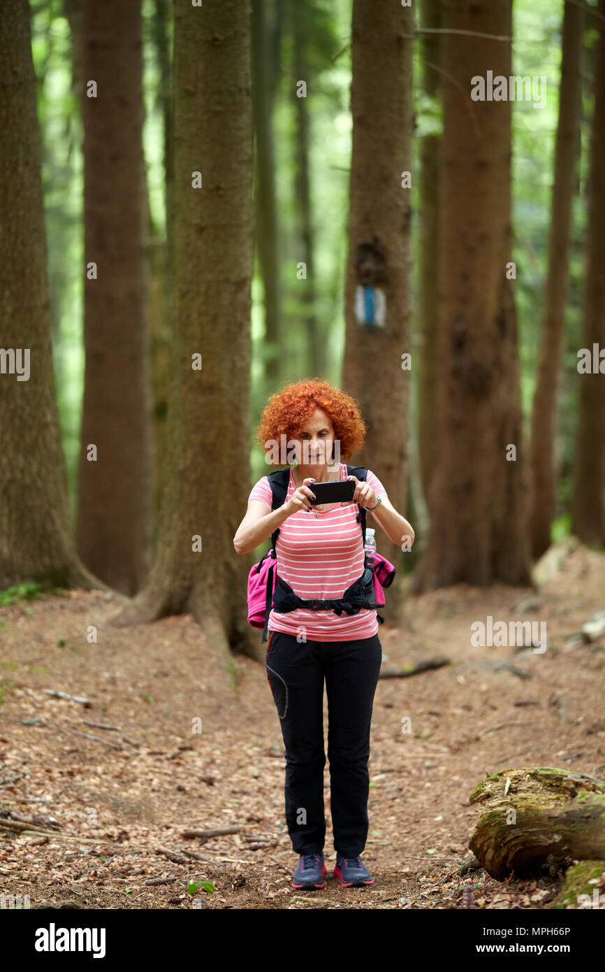 Hiker backpack taking photos hi-res stock photography and images - Alamy