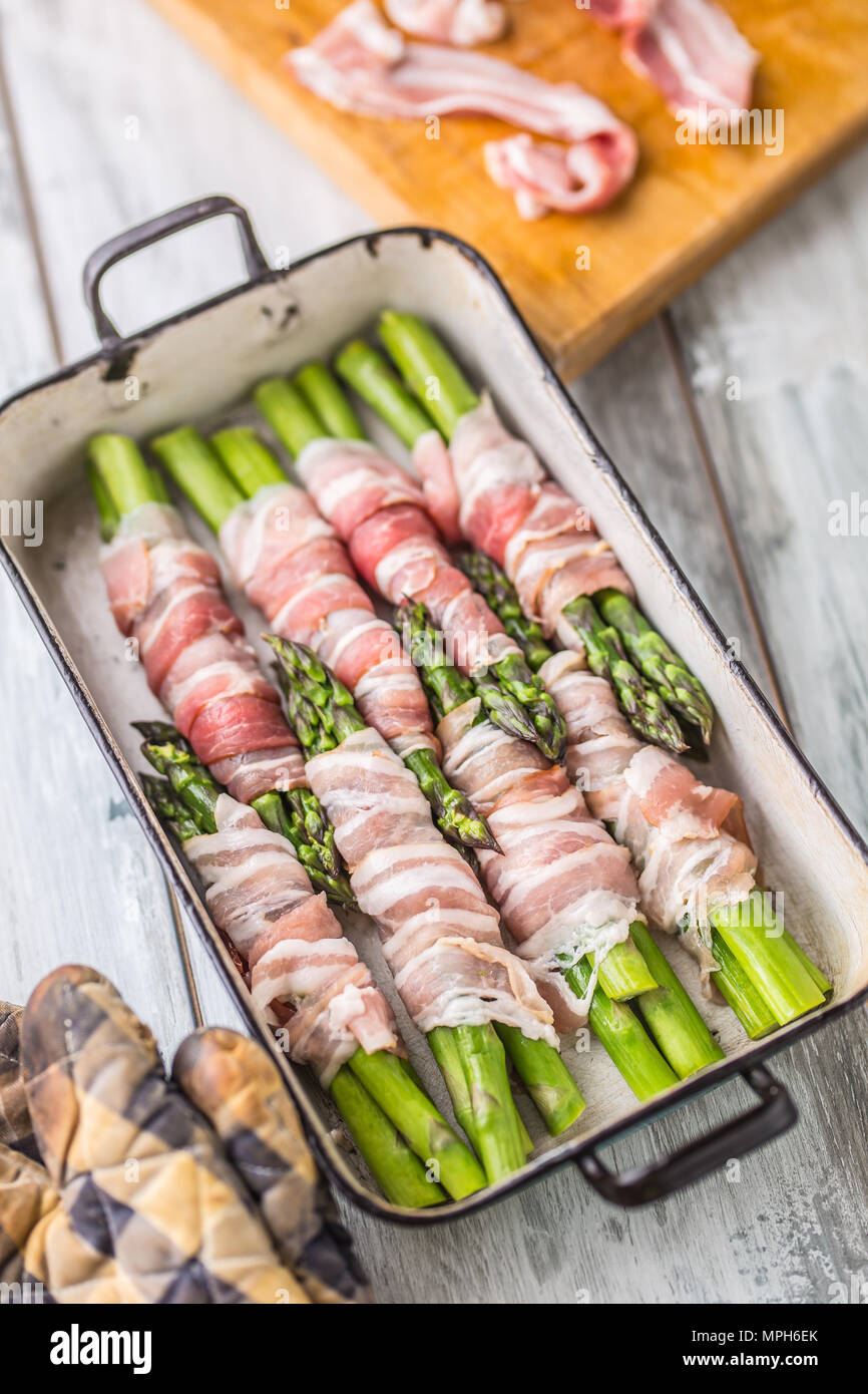 Tasty food bacon wrapped asparagus in frying pan Stock Photo Alamy