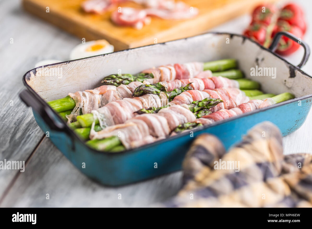 Tasty food bacon wrapped asparagus in frying pan Stock Photo Alamy