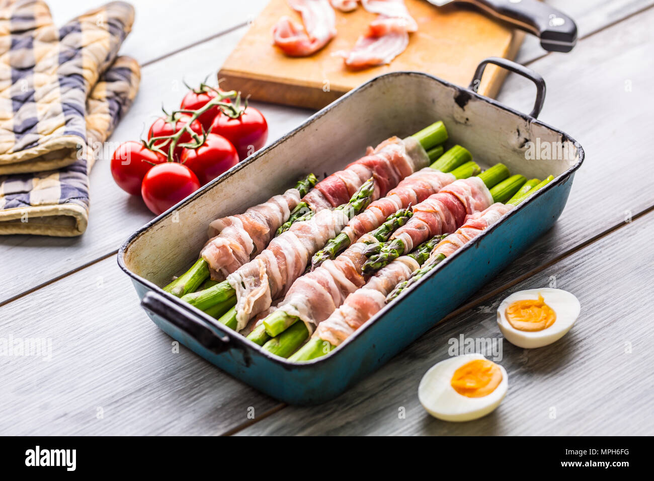 Tasty food bacon wrapped asparagus in frying pan Stock Photo Alamy