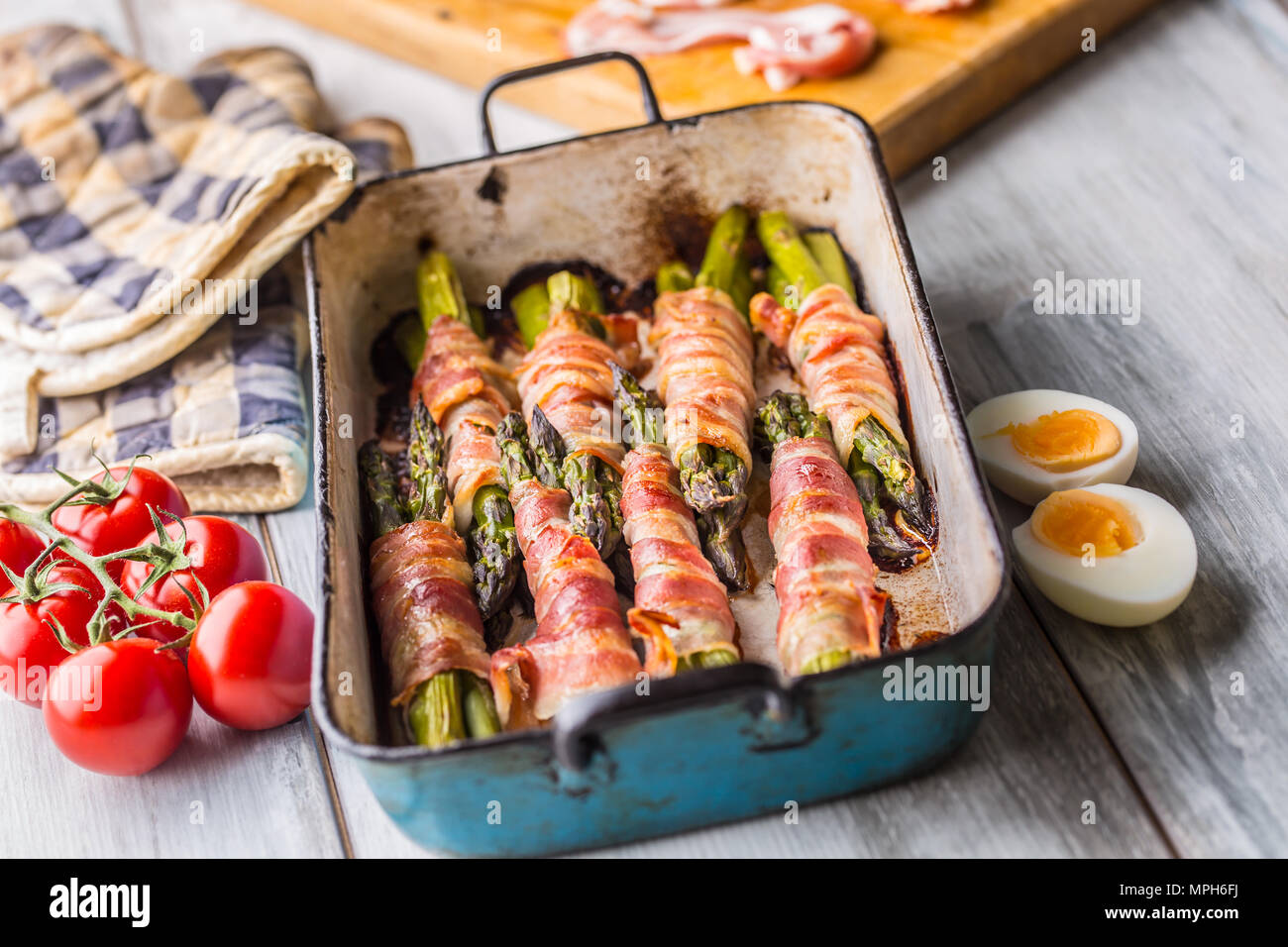 Tasty food bacon wrapped asparagus in frying pan Stock Photo Alamy