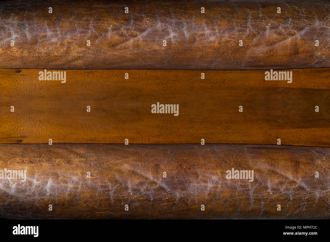 old brown leather, wooden surface in the middle with space for text, background image Stock Photo