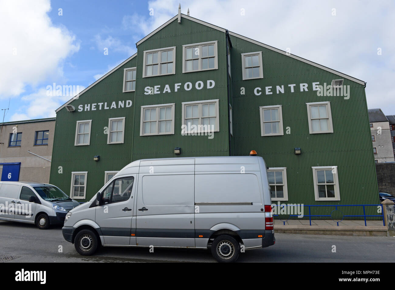 Stewart Building in Shetland on the quayside home to the Shetland Seafood Centre and SNH with signage on the outside of the building Stock Photo