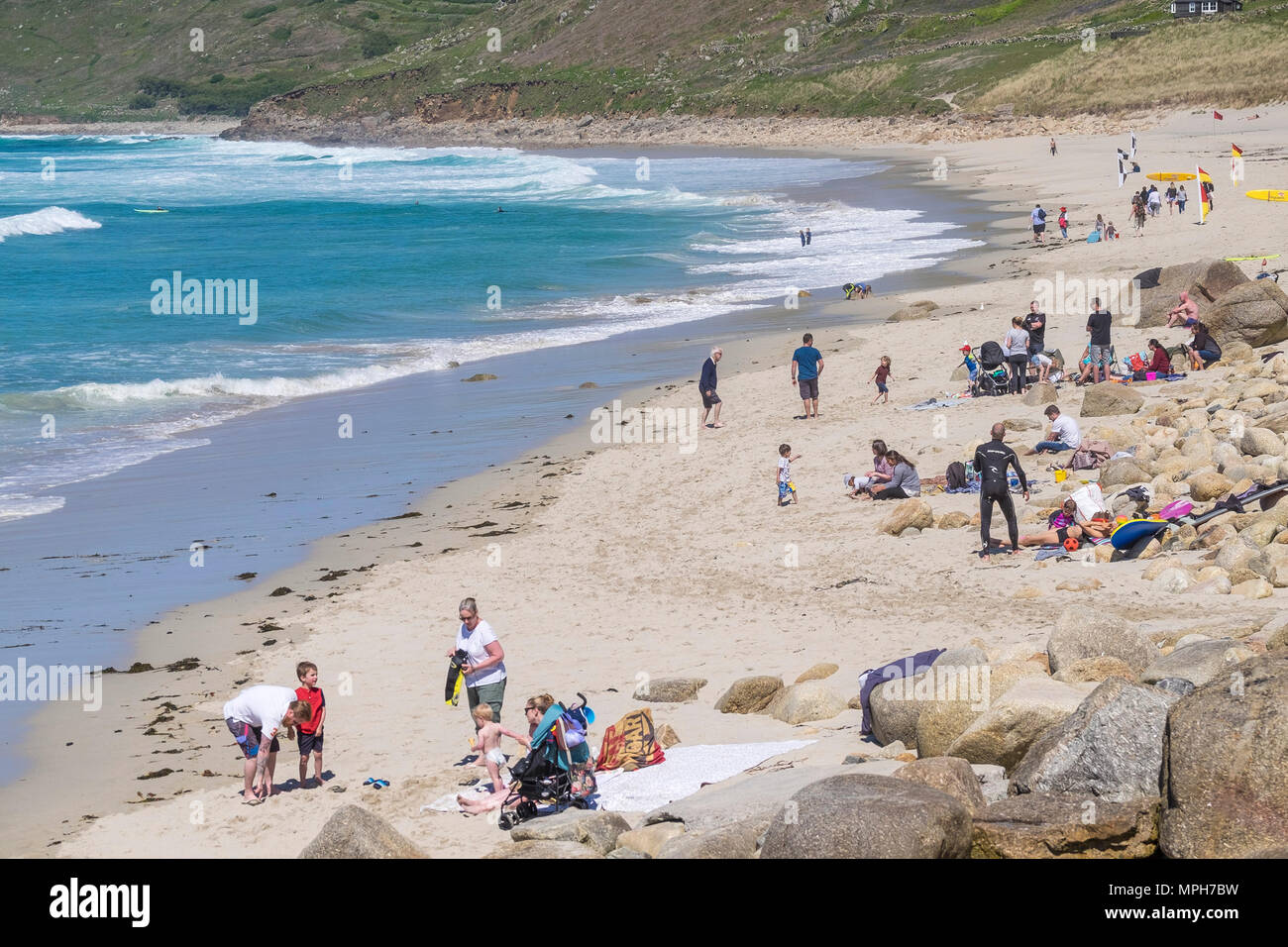 Holidaymakers at Sennen Cove in Cornwall. Stock Photo