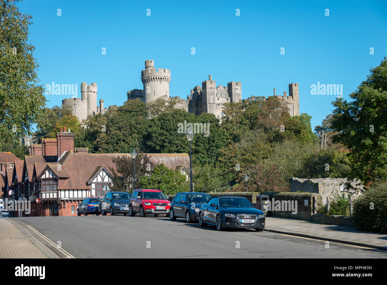 Arundel Town Castle. Cars parked along a road near to Arundel Castle in Arundel, West Sussex, UK. Stock Photo