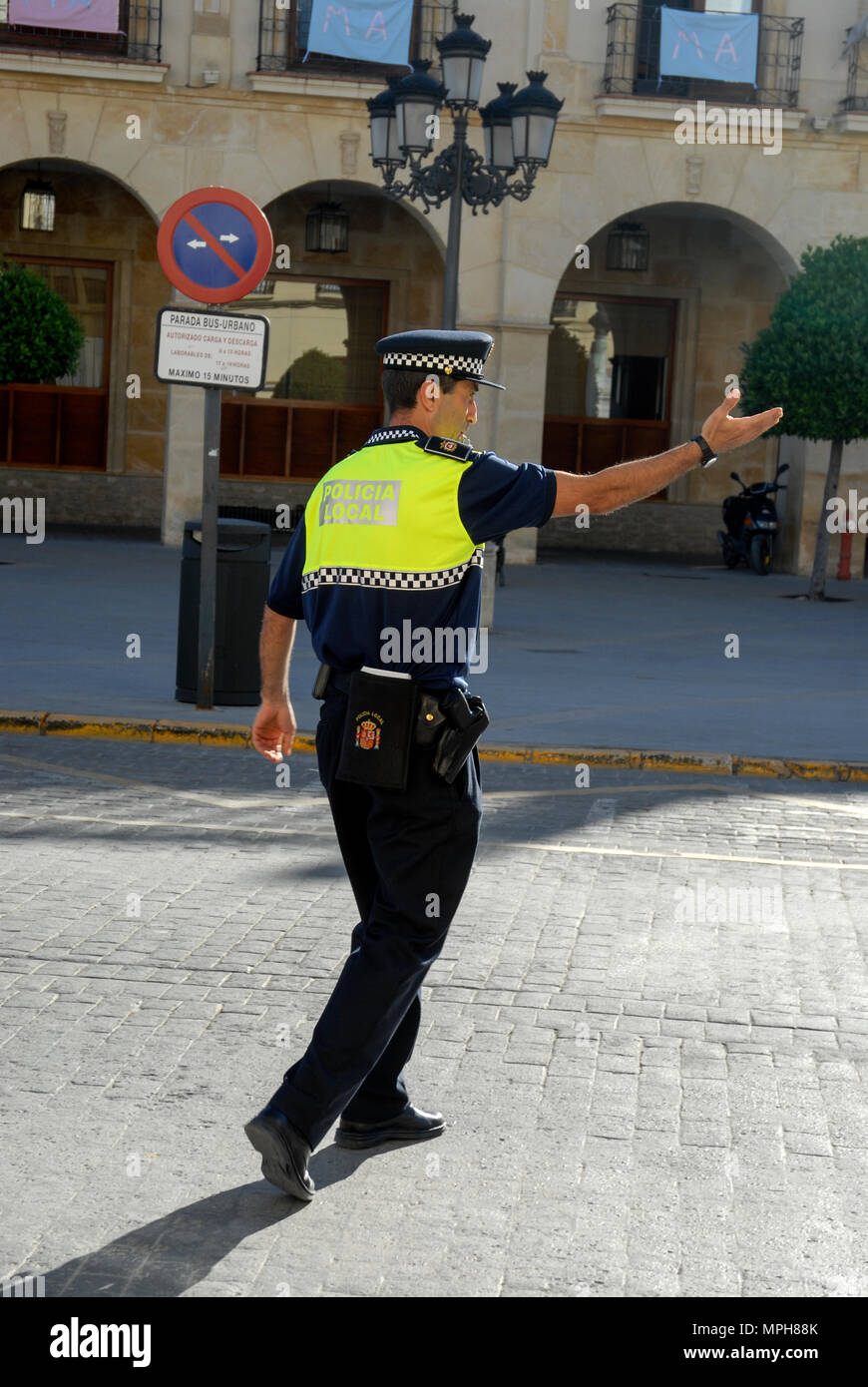 A local Spanish Police officer directing traffic inRonda, a small