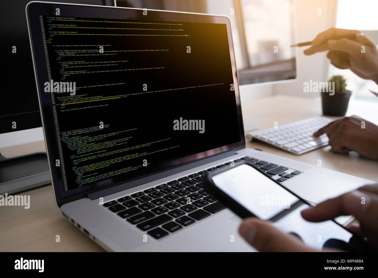 Programmer working Developing programming technologies Web Design Online Technology Stock Photo