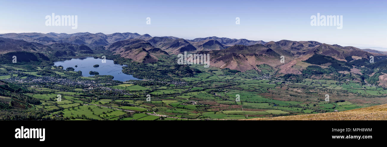 Panoramic view of Keswick, Derwent Water and the north-western fells from Skiddaw on a clear sunny day Stock Photo