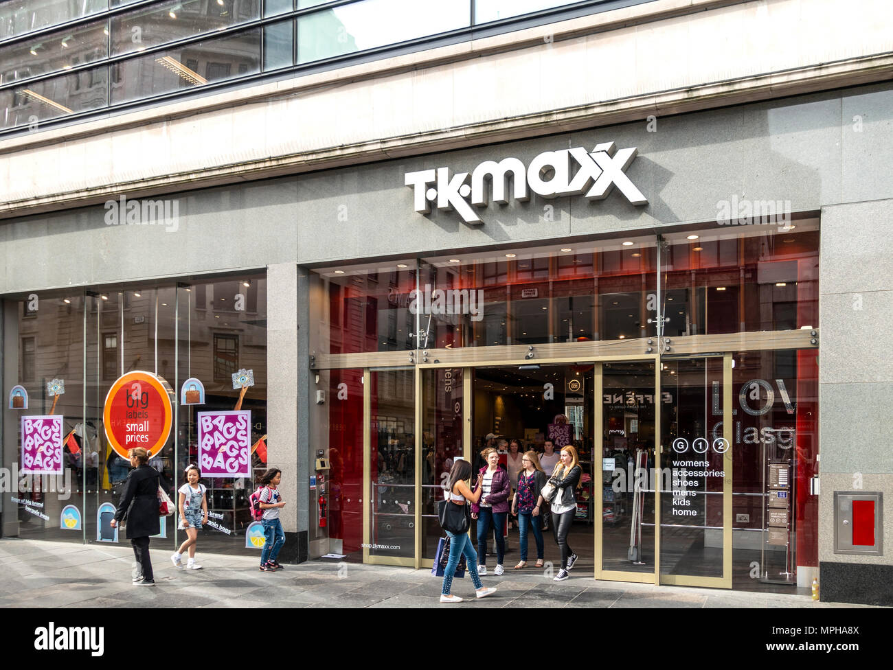 Customers entering and leaving the T.K.Maxx discount fashion and homewear shop branch in Argyle Street, central Glasgow, Scotland, UK Stock Photo