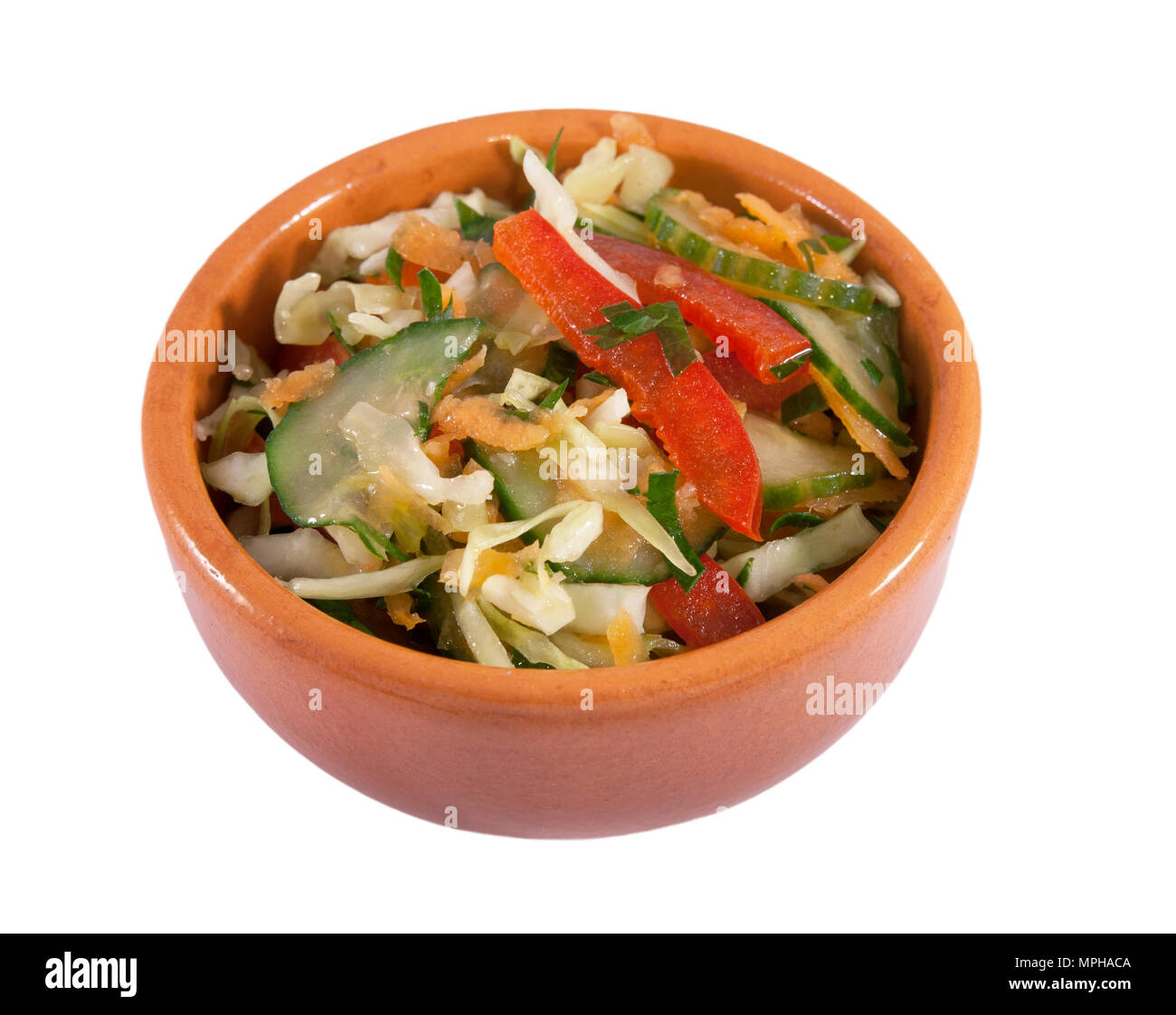 Salad with red sweet pepper, cabbage, cucumber, carrot oil and lemon juice Stock Photo