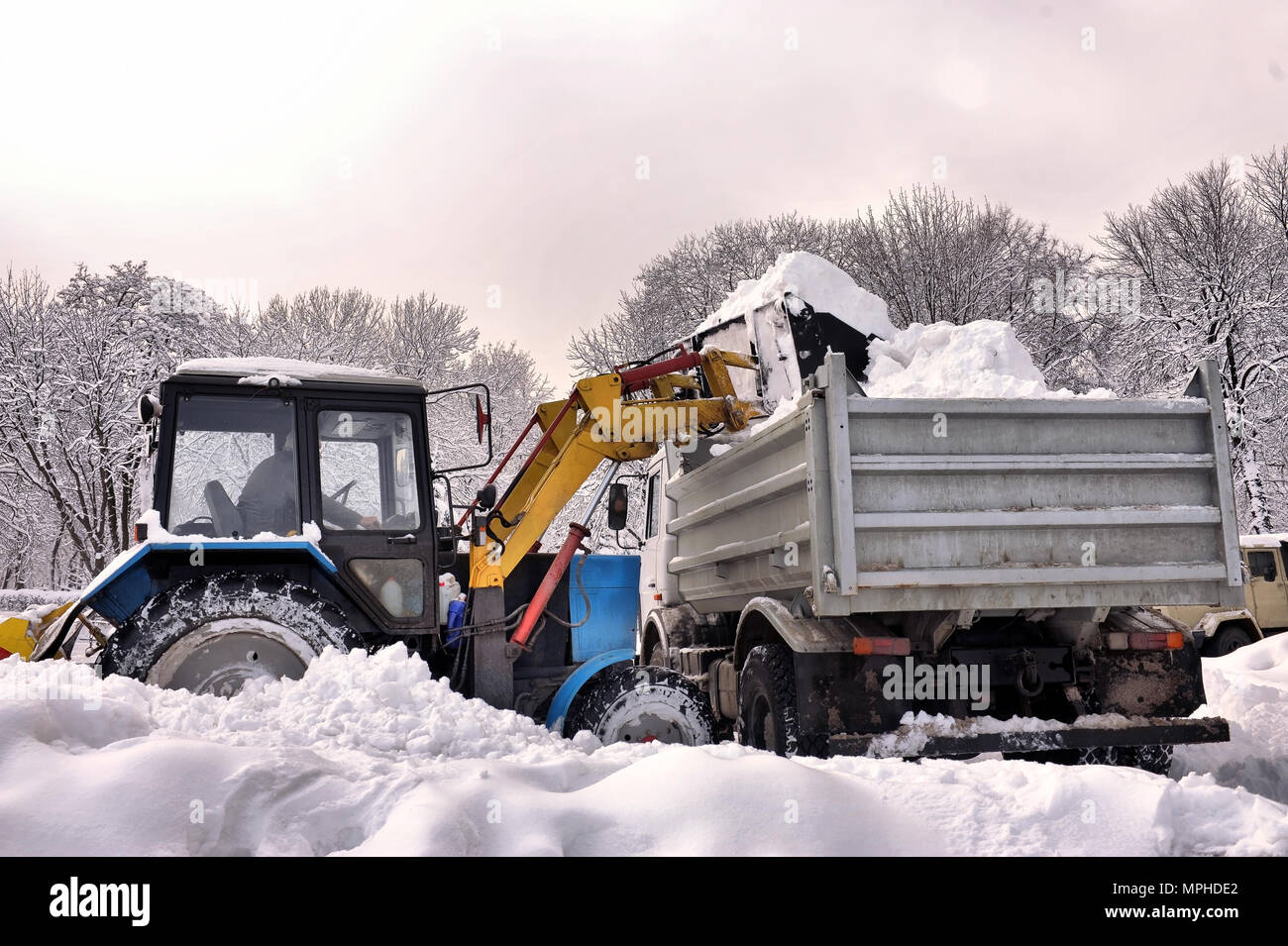 cleaning and snow loading on the truck Stock Photo - Alamy