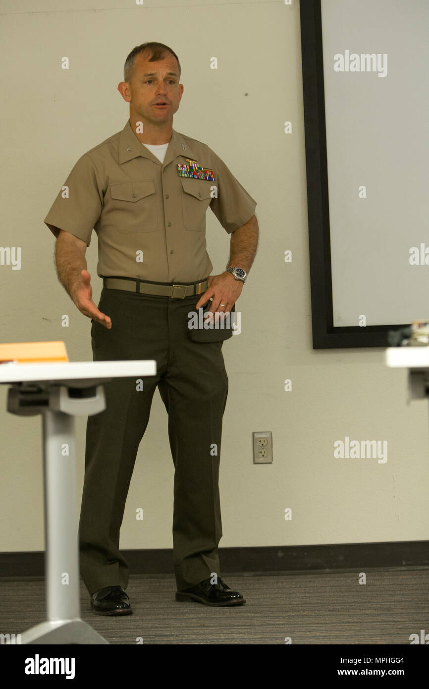 U.S. Marine Corps Col. James B. Wellons, commanding officer of Marine Aviation Weapons and Tactics Squadron One (MAWTS-1) welcomes students attending the first ever Advanced Aircraft Maintenance Officer Course (AAMOC) at Marine Corps Air Station Yuma, Ariz., on Mar. 13, 2017. AAMOC will empower Aircraft Maintenance Officers with leadership tools, greater technical knowledge, and standardized practices through rigorous academics and hands on training in order to decrease ground related mishaps and increase sortie generation. (U.S. Marine Corps photo taken by Cpl. AaronJames B. Vinculado) Stock Photo