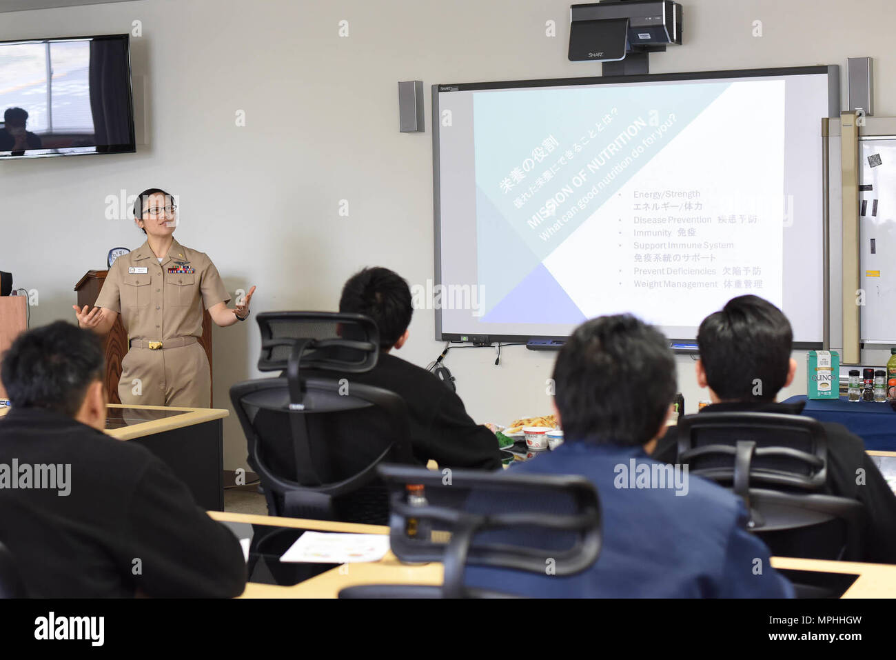 YOKOSUKA, Japan (Mar. 15, 2017) – U.S. Naval Hospital (USNH) Yokosuka Dietitian, Lt.j.g. Mari Moffitt, speaks on health nutrition during a seminar conducted for Japanese staff members of Commander, Navy Region Japan (CNRJ) Fire and Emergency Services, Yokosuka, Mar. 15. The seminar was a collaborative effort between the hospital and local Japanese nutritionists to provide training on proper dieting and weight management. USNH Yokosuka is the largest U.S. military treatment facility on mainland Japan caring for approximately 43,000 eligible beneficiaries. (US Navy photo by USNH Yokosuka PAO/Rel Stock Photo
