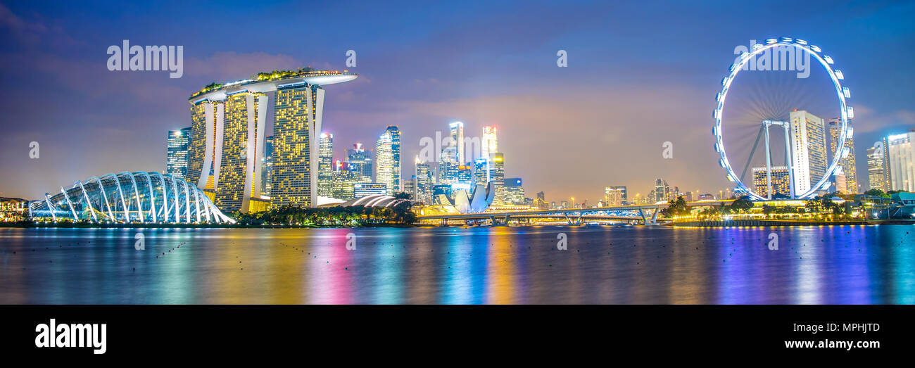 Panorama of Singapore city skyline by night Stock Photo