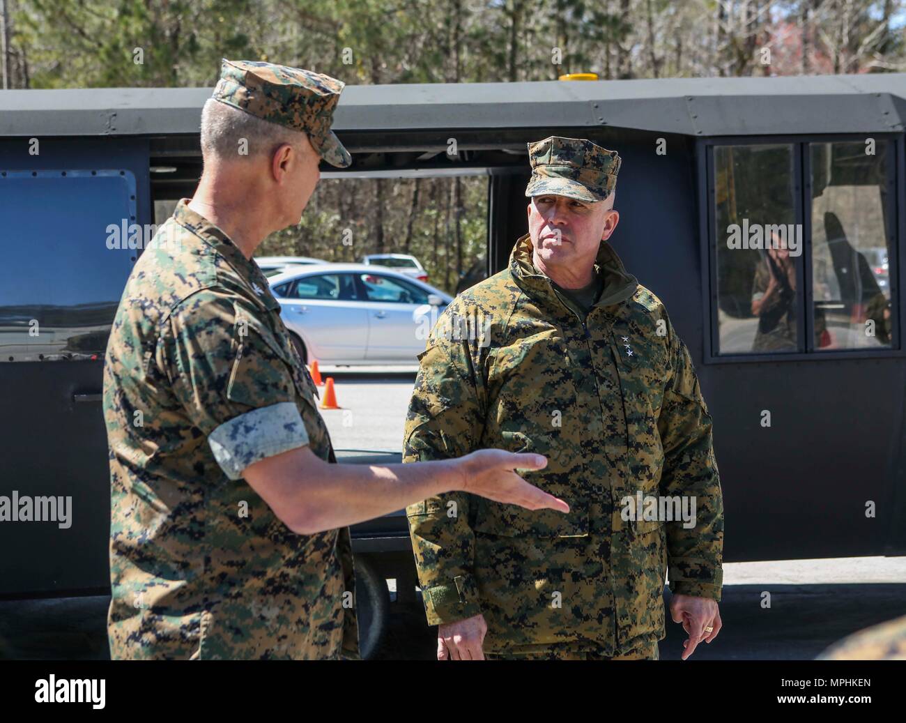 U.S. Navy Capt. Brian G. Tolbert, Commanding Officer 2nd Dental Battalion, 2nd Marine Logistics Group (MLG), left, speaks with Lt. Gen. John E. Wissler, Commander, U.S. Marine Corps Forces Command, Commanding General, Fleet Marine Forces, Atlantic, on Camp Lejeune, N.C., March 15, 2017. Wissler visited 2nd MLG to conduct a commanders workshop, engage senior leaders on designated topics, and observe training activities at various 2D MLG units. (U.S. Marine Corps photo by Lance Cpl. Tyler W. Stewart) Stock Photo