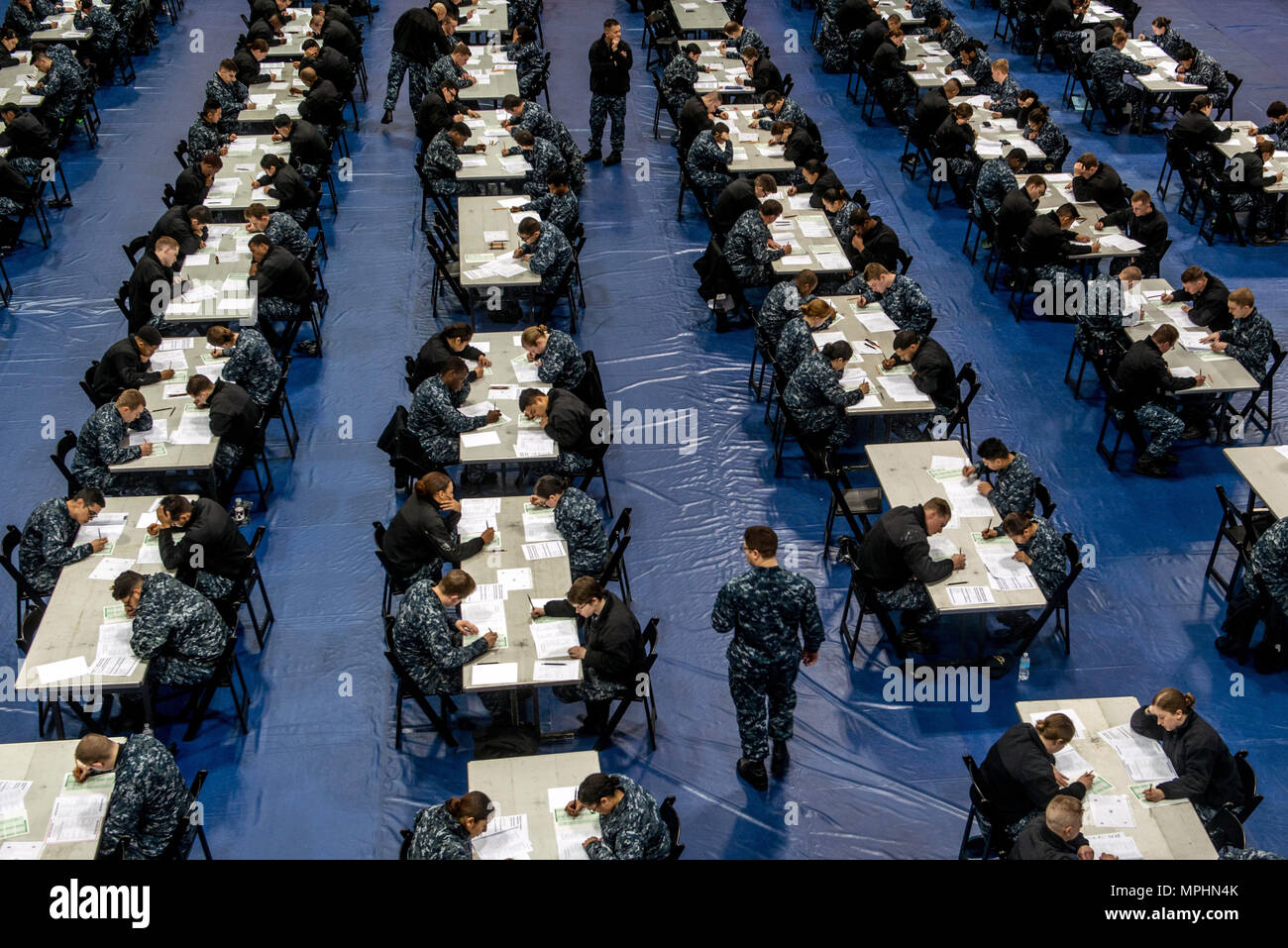 170316-N-OI810-041  YOKOSUKA, Japan (March 16, 2017)  Sailors assigned to the aircraft carrier USS Ronald Reagan (CVN 76) take the Navy-wide E-4 advancement exam at James D. Kelly Fleet Recreation Center. Ronald Reagan is the flagship of Carrier Strike Group 5, providing a combat-ready force that protects and defends the collective maritime interests of its allies and partners in the Indo-Asia-Pacific region. (U.S. Navy photo by Mass Communication Specialist 2nd Class Nathan Burke/Released) Stock Photo