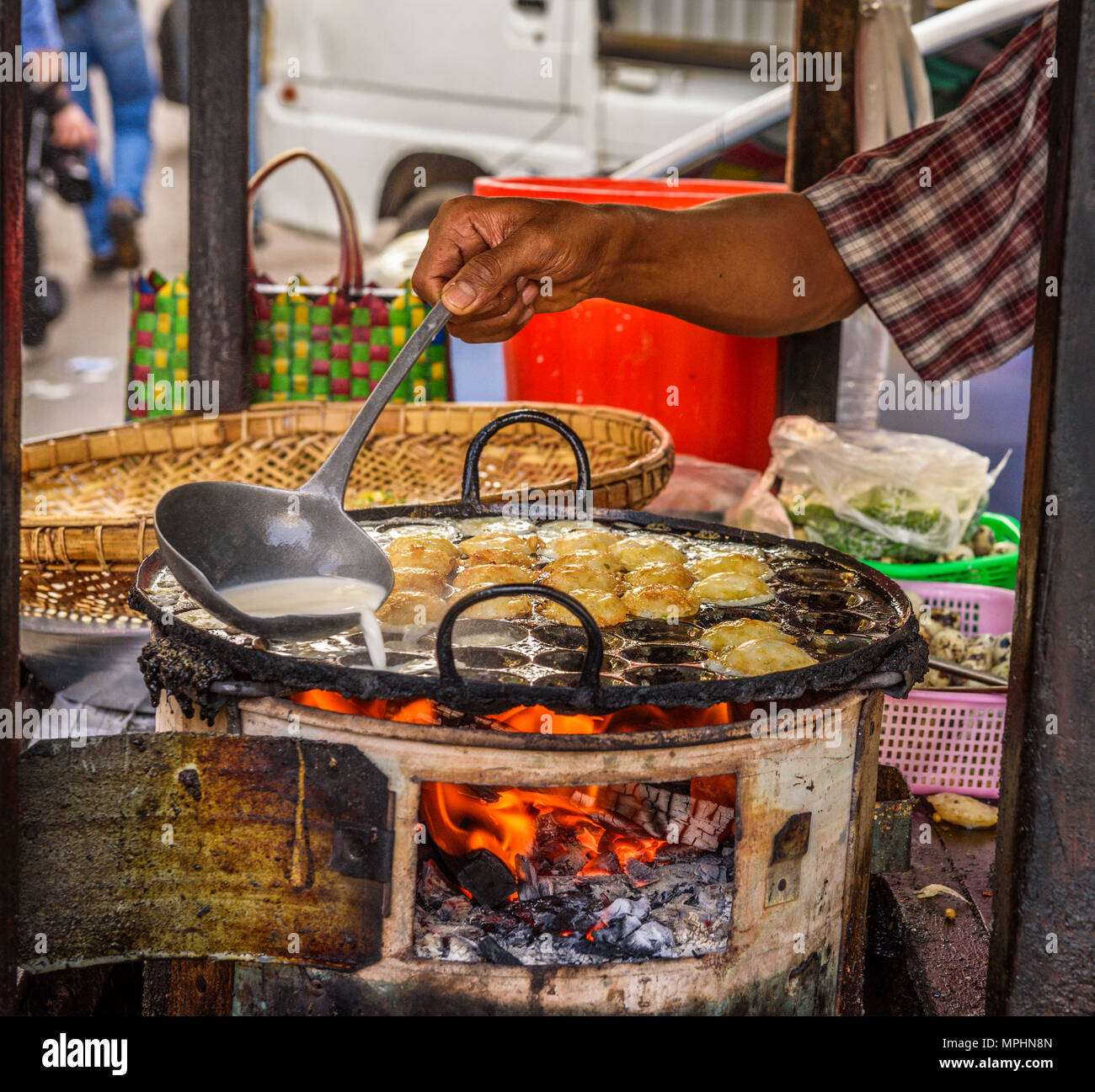 Cook prepares street food in Myanmar Stock Photo