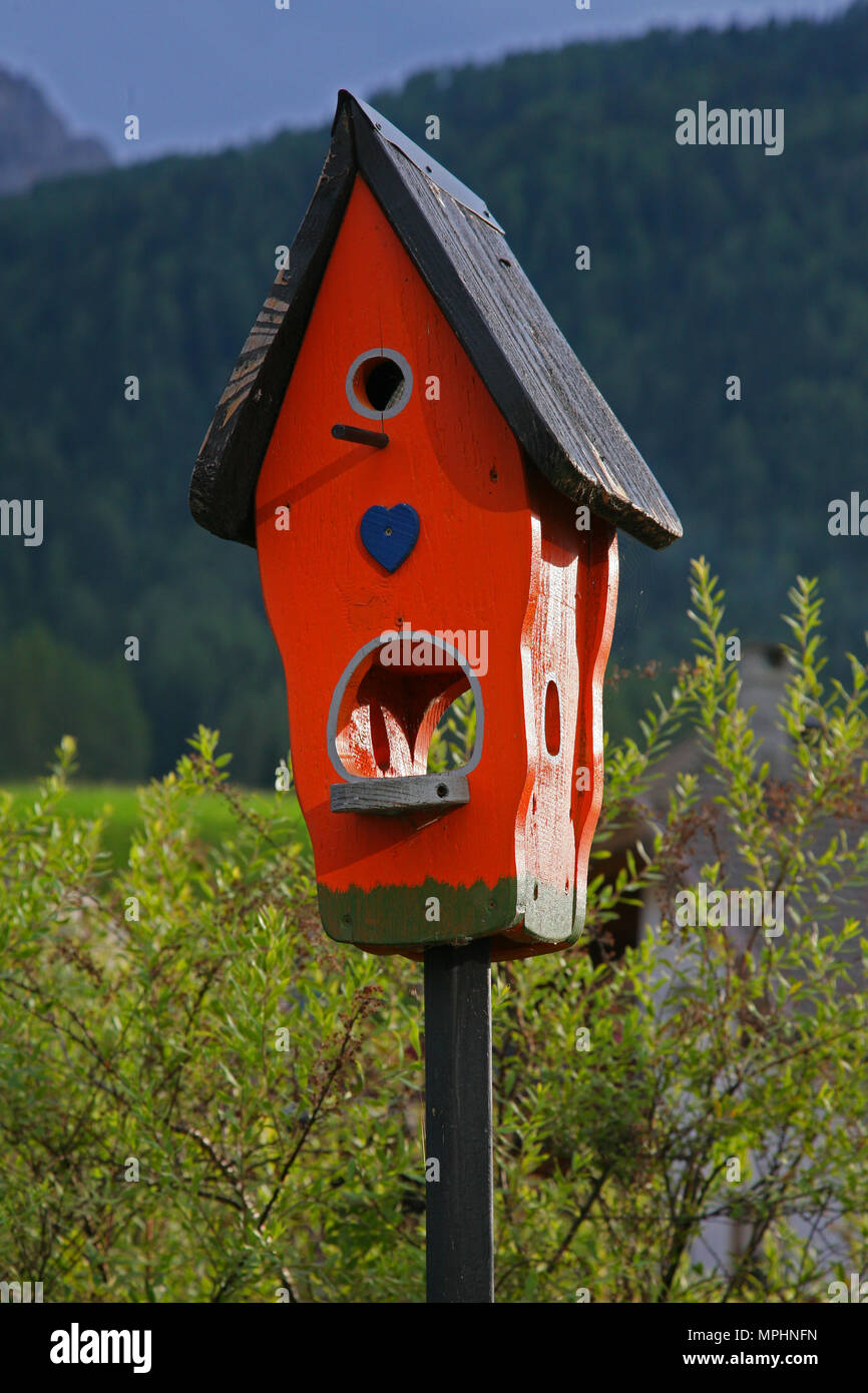 Red Wooden birdhouse isolated Stock Photo
