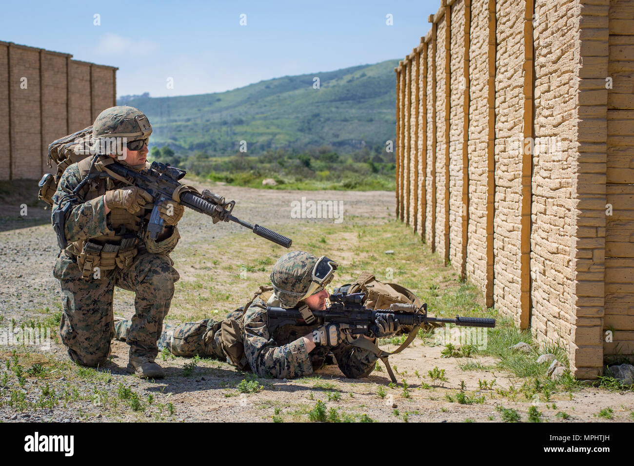 Marines with 3rd Battalion, 5th Marine Regiment provides security during a raid rehearsal at Camp Pendleton, Calif., March 16, 2017. Marines with 3rd Battalion, 5th Marine Regiment are training to maintain unit proficiency and preparing to deploy with the 15th Marine Expeditionary Force. (U.S. Marine Corps photo by Lance Cpl. Rhita Daniel) Stock Photo