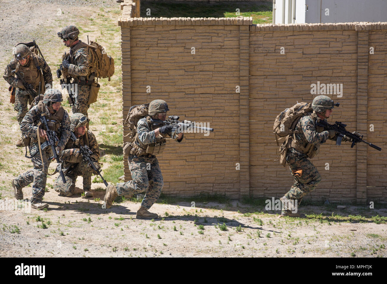 Marines with 3rd Battalion, 5th Marine Regiment buddy-rush during a raid rehearsal at Camp Pendleton, Calif., March 16, 2017. Marines with 3rd Battalion, 5th Marine Regiment are training to maintain unit proficiency and preparing to deploy with the 15th Marine Expeditionary Force. (U.S. Marine Corps photo by Lance Cpl. Rhita Daniel) Stock Photo