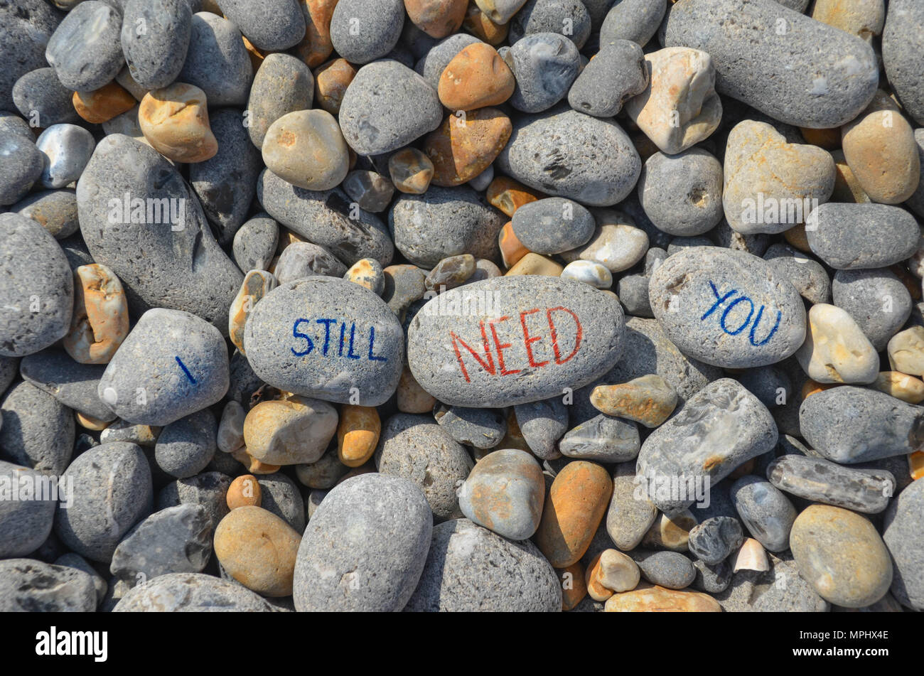 Pebble words on the beach Stock Photo