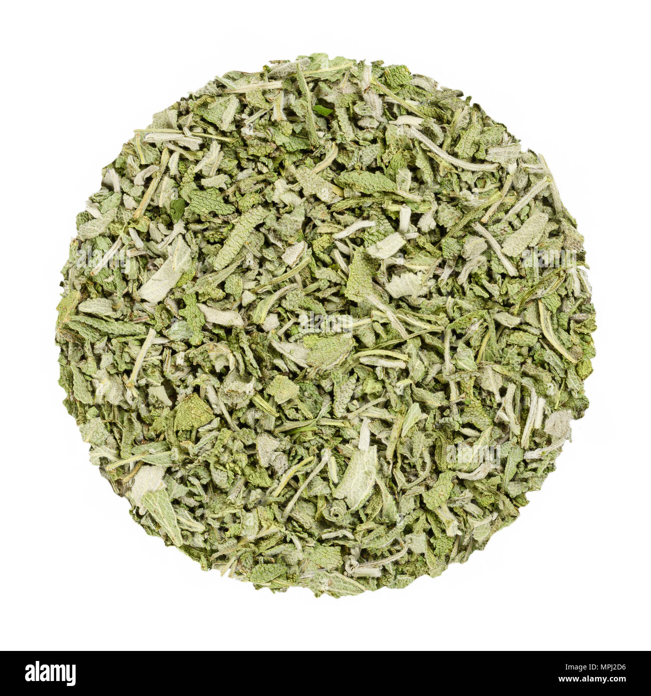 Dried sage. Herb circle from above, isolated, over white. Disc made of chopped common sage. Salvia officinalis. Grayish herb, spice and medical plant. Stock Photo
