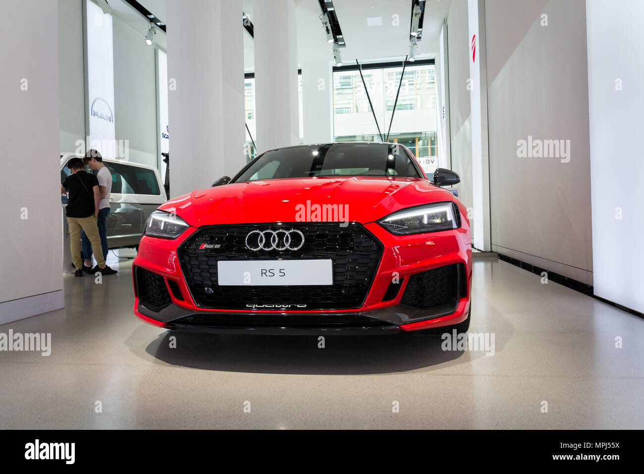 BERLIN, GERMANY - APRIL 15 2018: Audi company logo on Audi RS 5 car standing at Volkswagen Group forum Drive on April 15, 2018 in Berlin, Germany. Stock Photo
